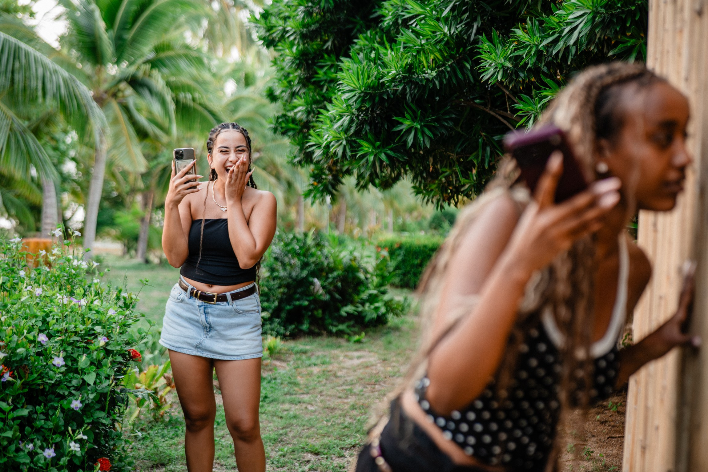 A joyful surprise proposal moment in Koh Samui, Thailand, capturing genuine emotions, laughter and excitement in a beautiful tropical garden setting.