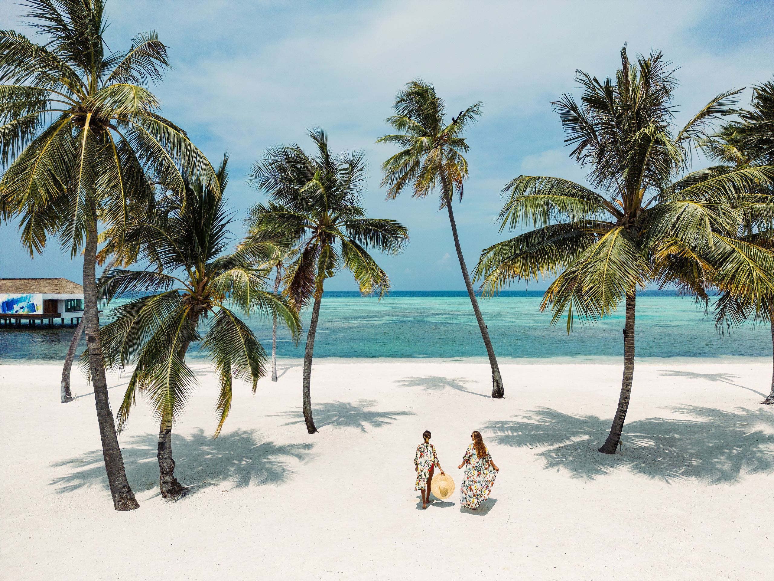 Resortwear photography showcasing sophisticated vacation style by the ocean