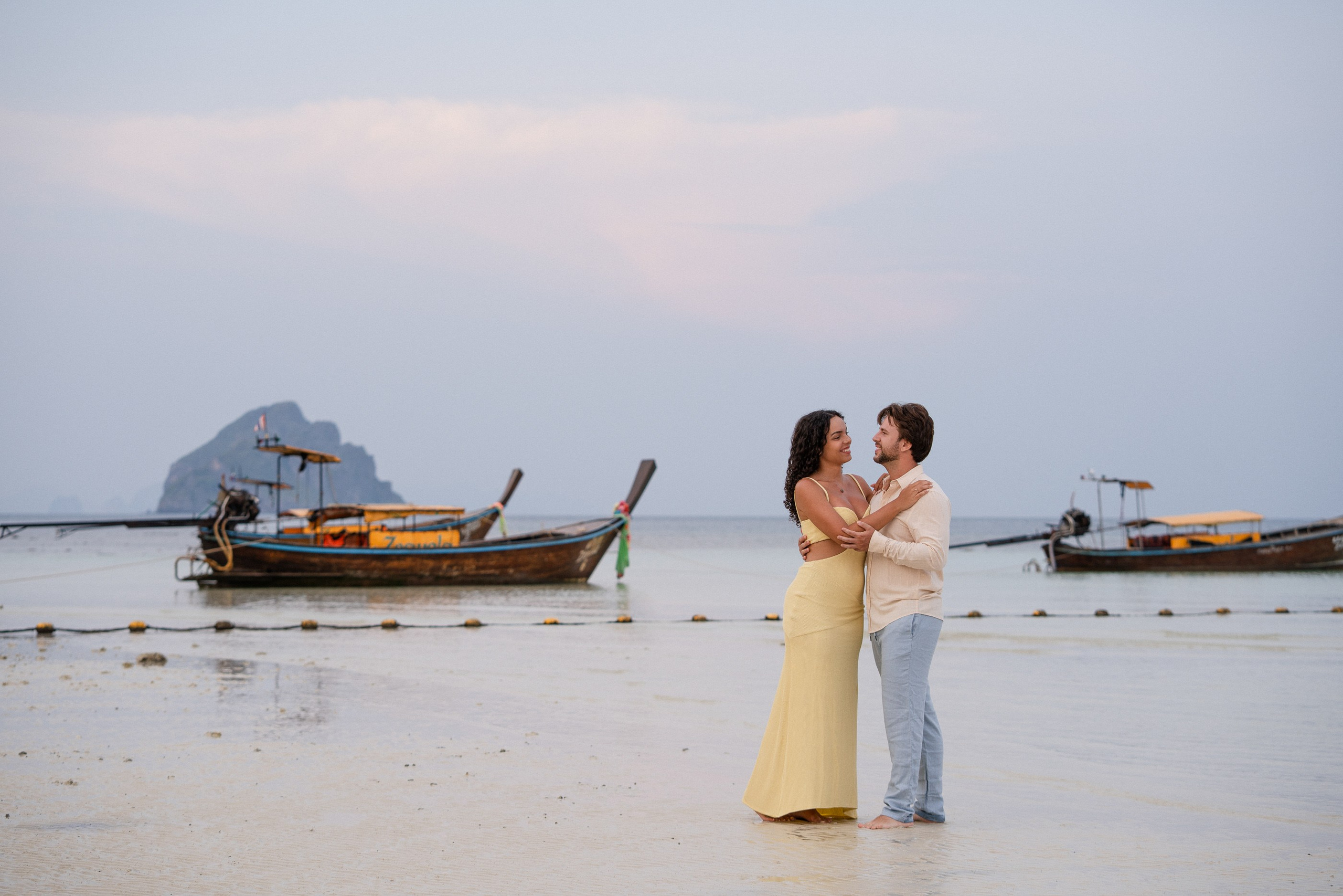 Romantic destination wedding photography in Phuket featuring newlyweds on a tropical beach