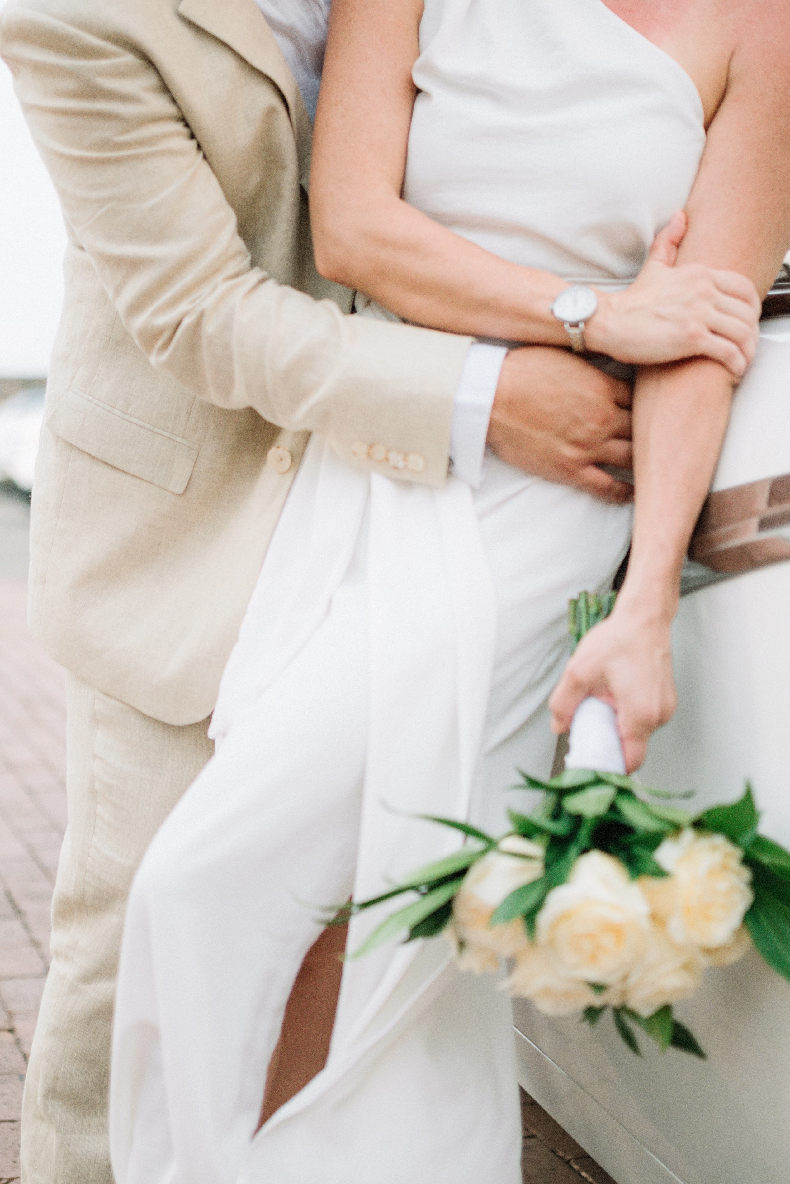 Bride holding bouquet – “Smiling bride holding a bouquet of flowers in Cartagena, high-quality wedding photography