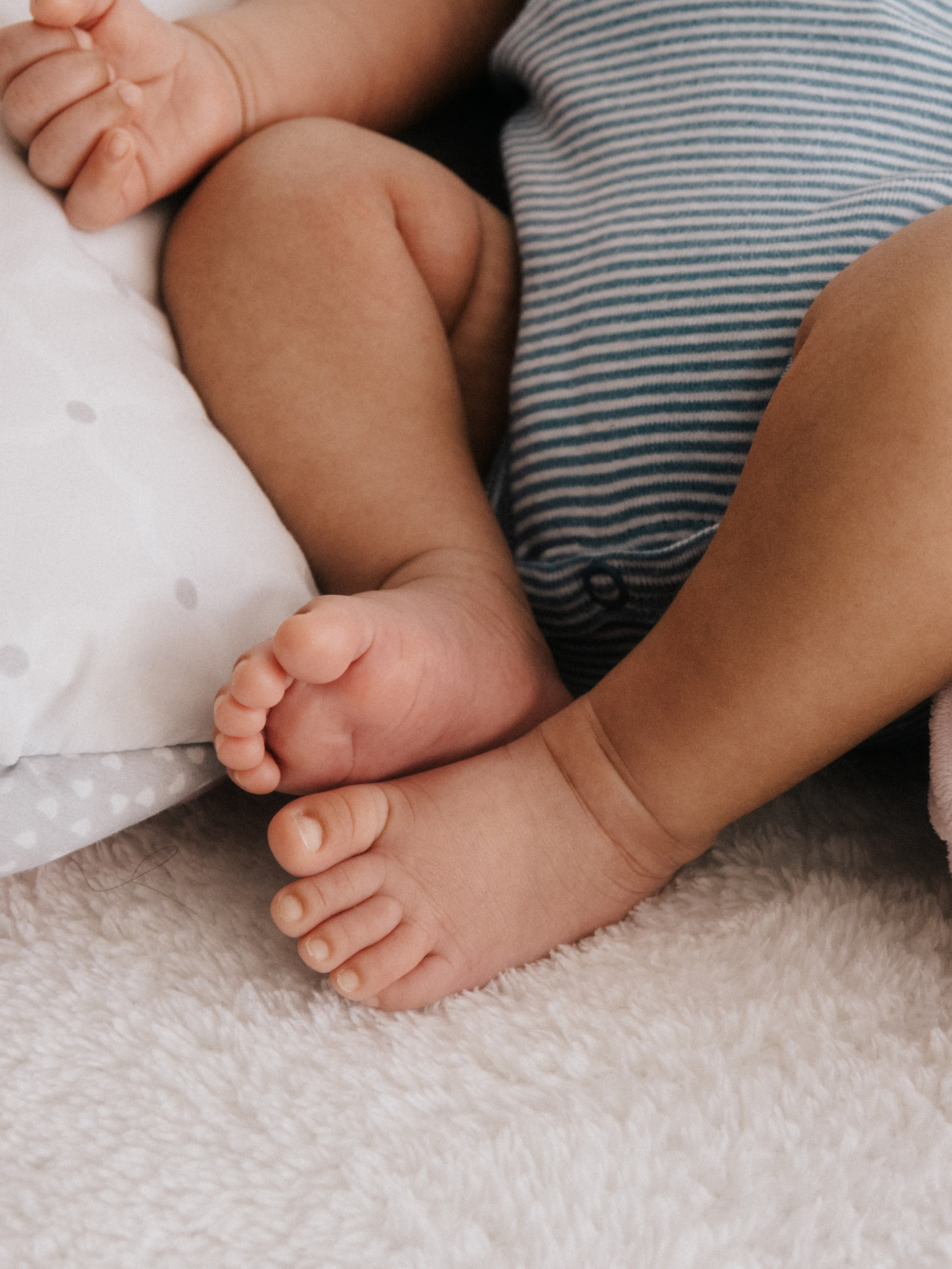 Close up photo of tiny toes of a newborn baby.
