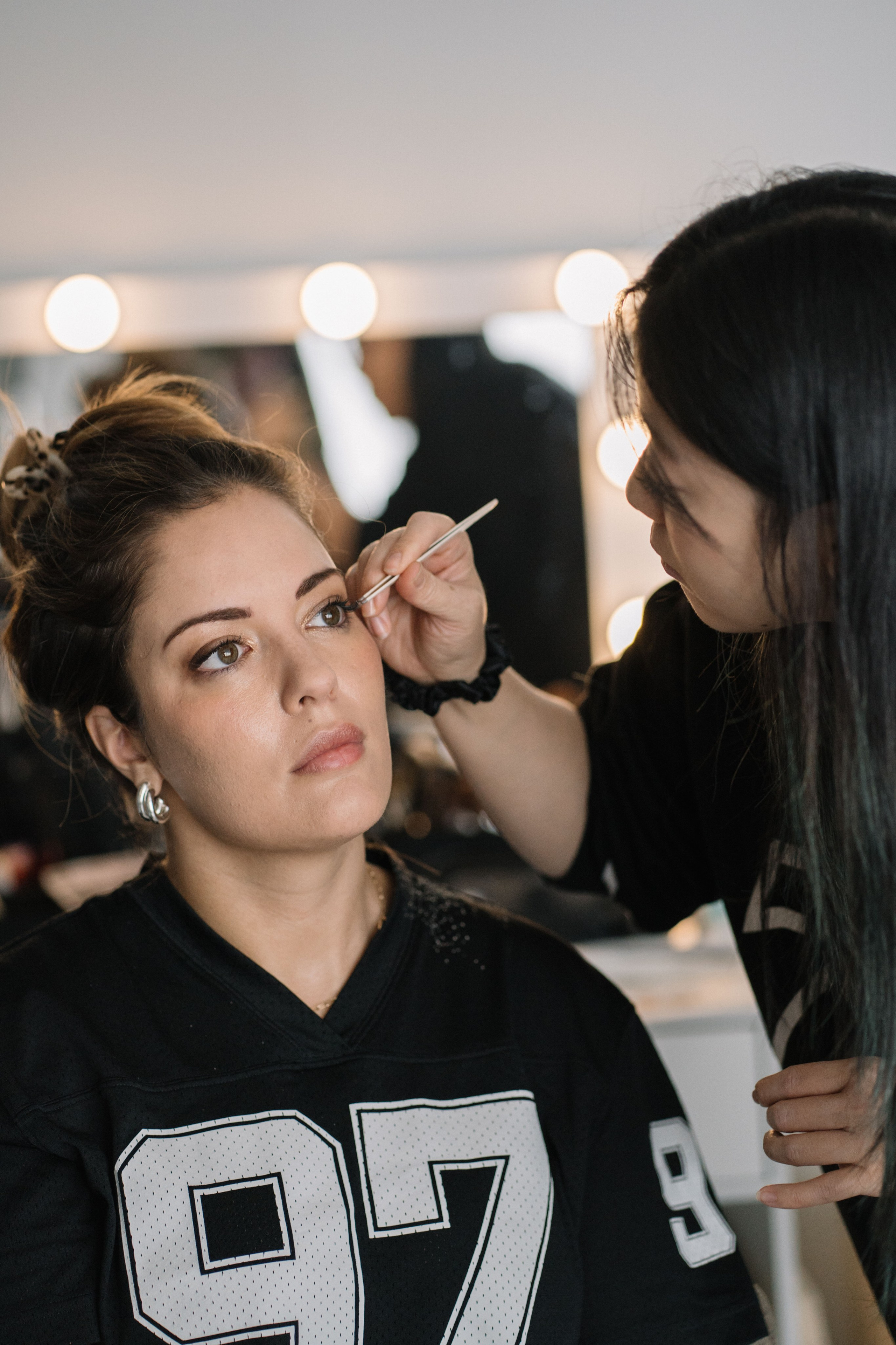 Professional makeup application for heirloom portrait session in Burnaby photography studio with soft natural light