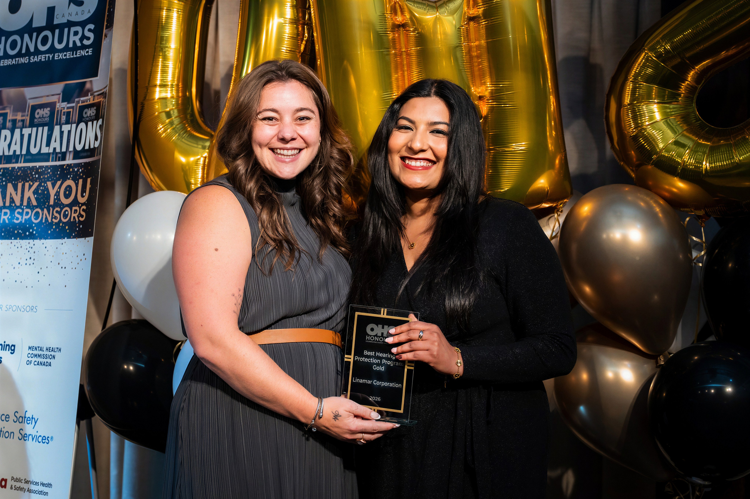 OHS Honours award recipient holding trophies at the Toronto awards gala