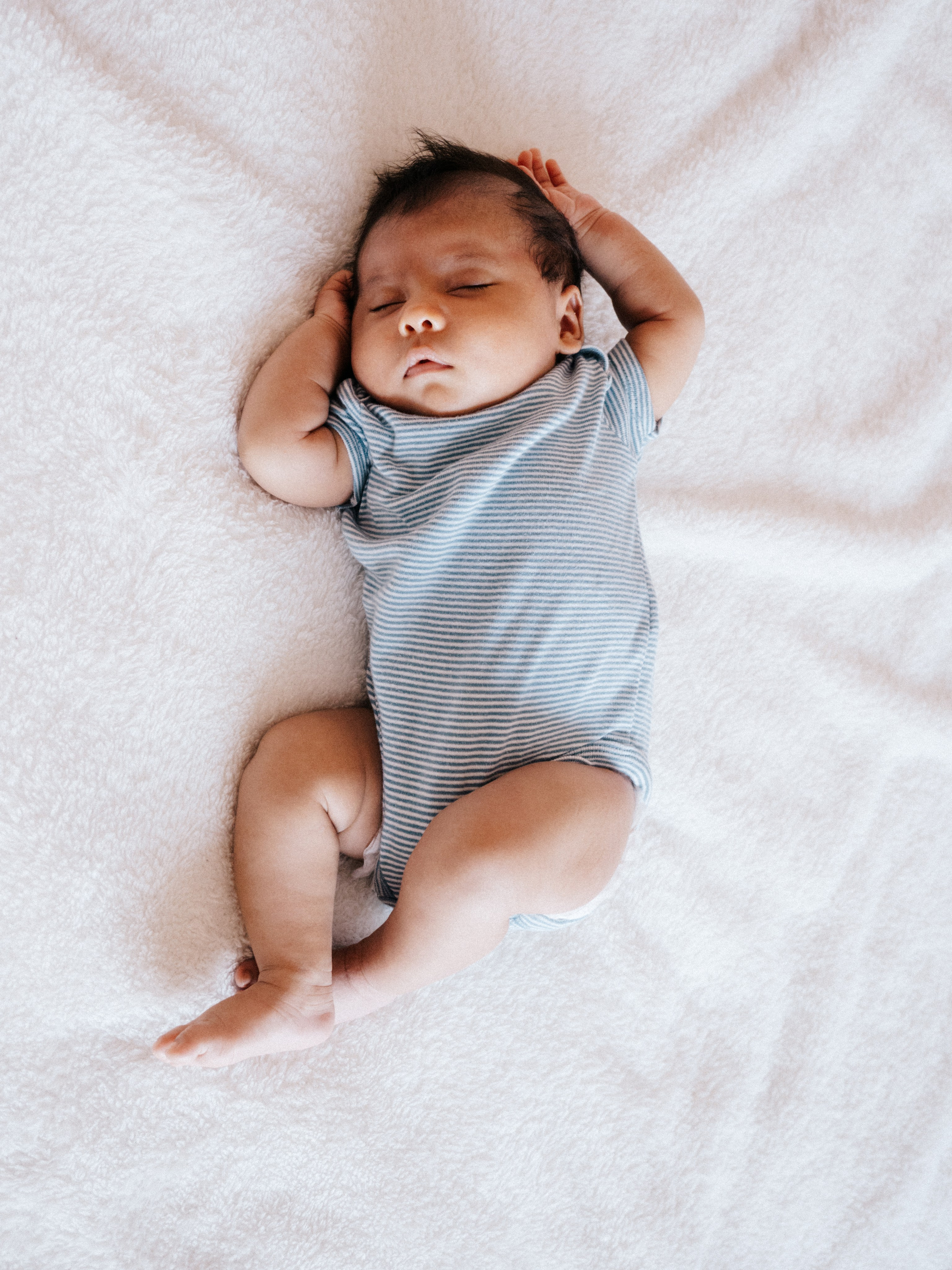 Newborn baby on soft background.