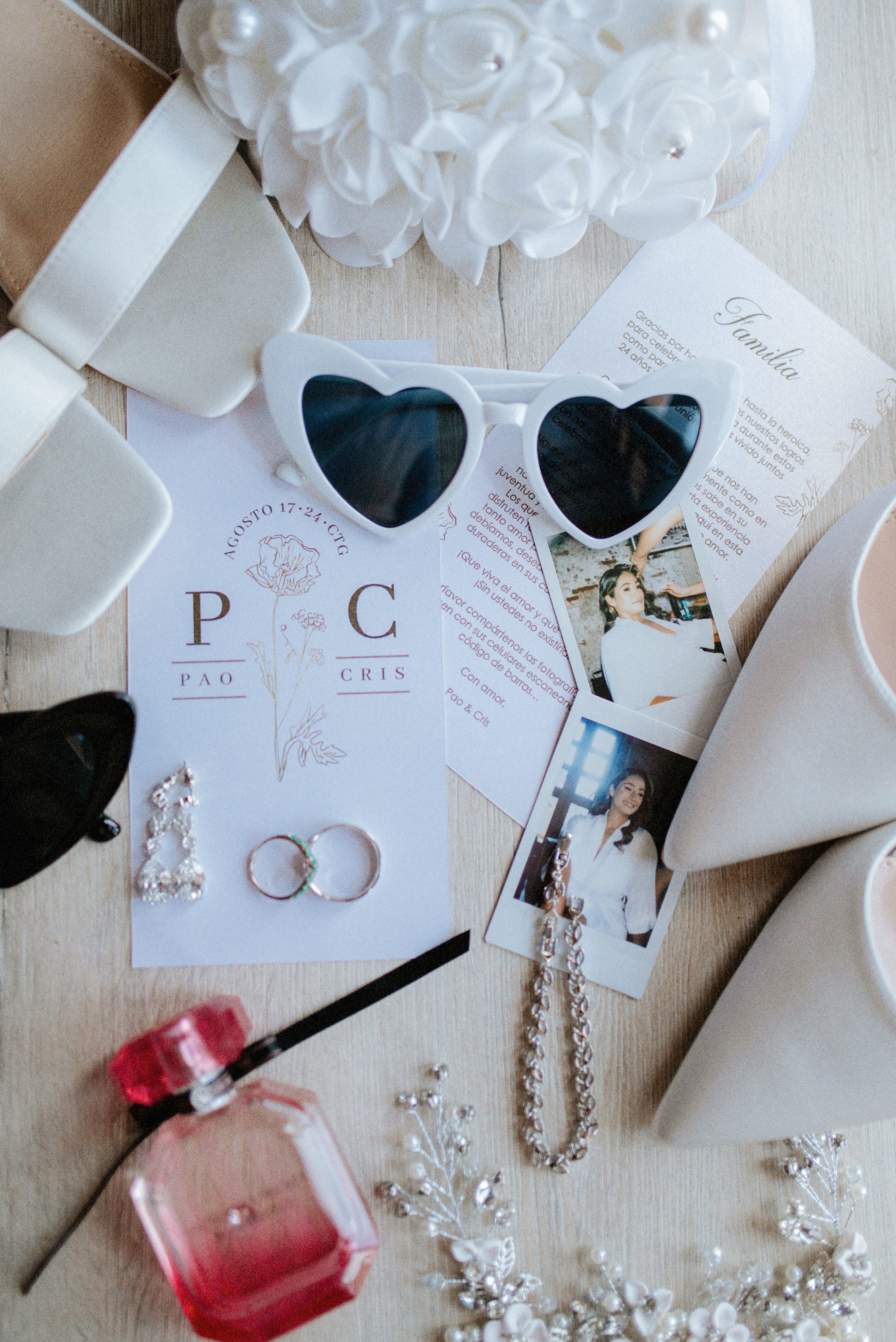 Wedding accessories flat lay – “Close-up of wedding accessories: rings, makeup, and invitation details, creative wedding photography