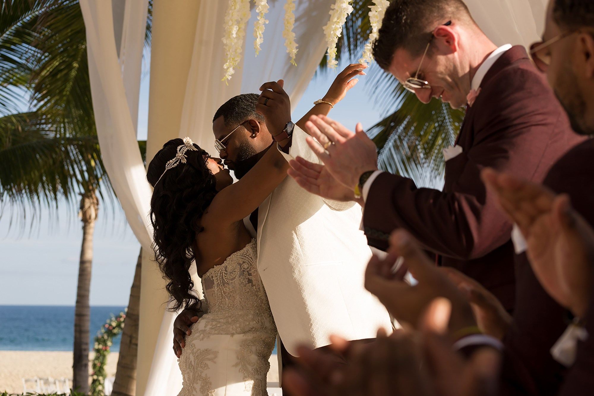 Candid wedding moment between bride and groom at Hyatt Ziva resort in Los Cabos