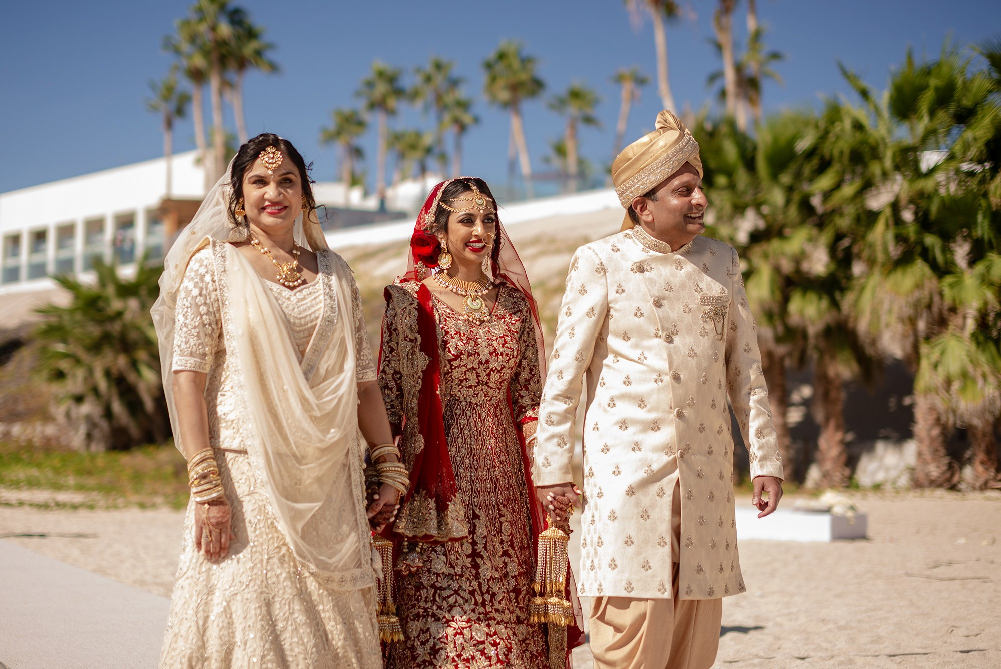 Indian bride with her parents during Kanya Aagman ceremony at destination wedding in Los Cabos Mexico