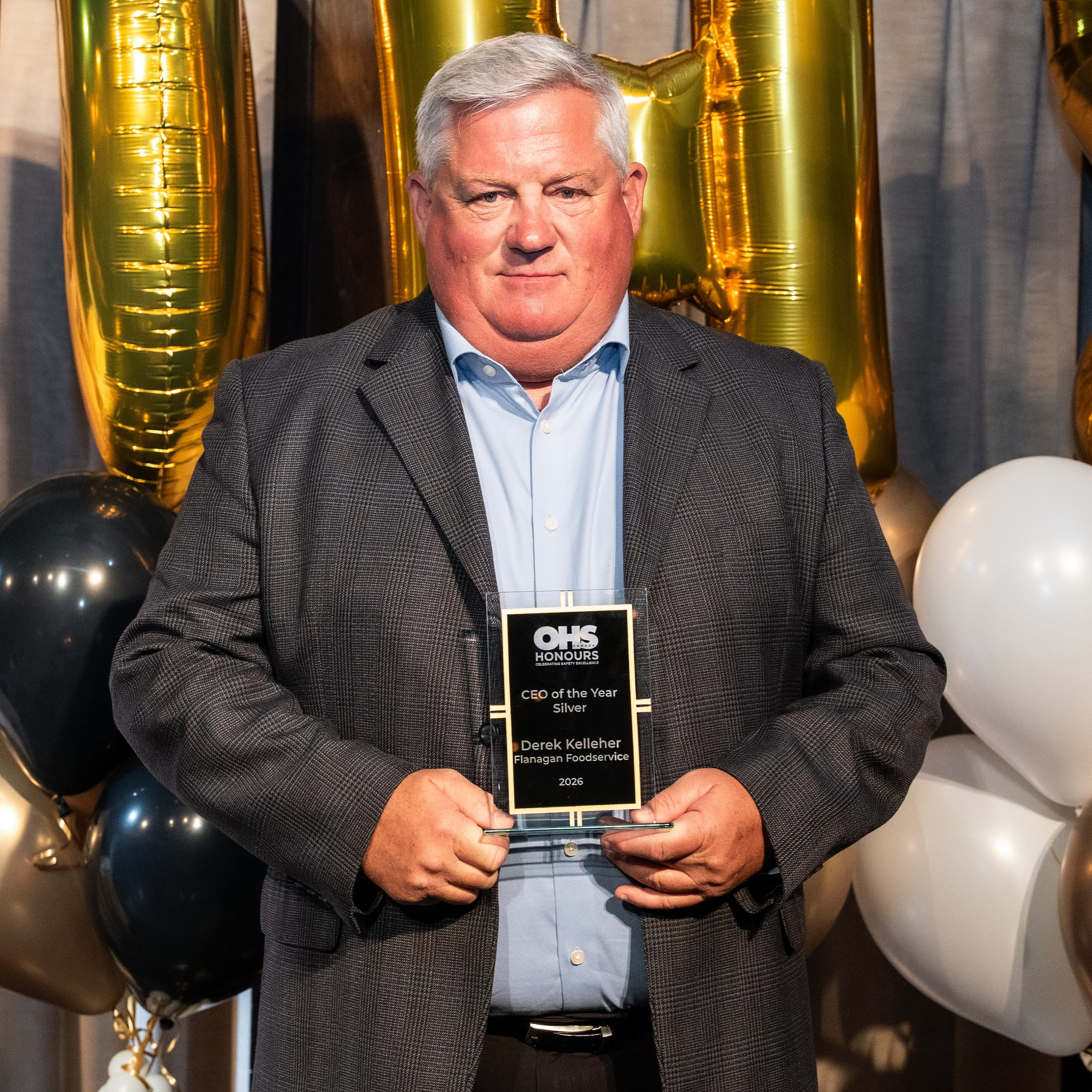 OHS Honours award recipient holding trophy during the 2026 gala