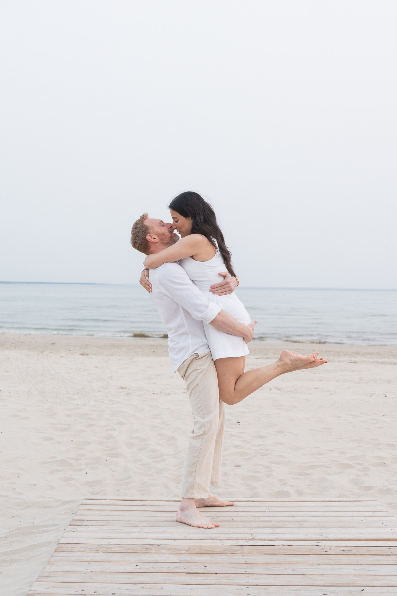 Sunset kiss by the lake — a heartfelt moment before the wedding day