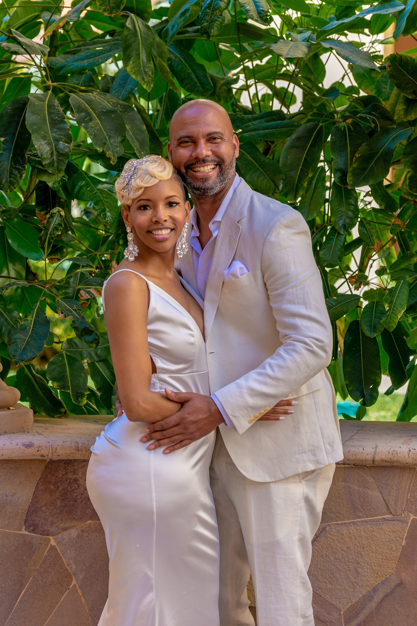 Joyful newlyweds portrait in natural light during destination beach wedding in Los Cabos
