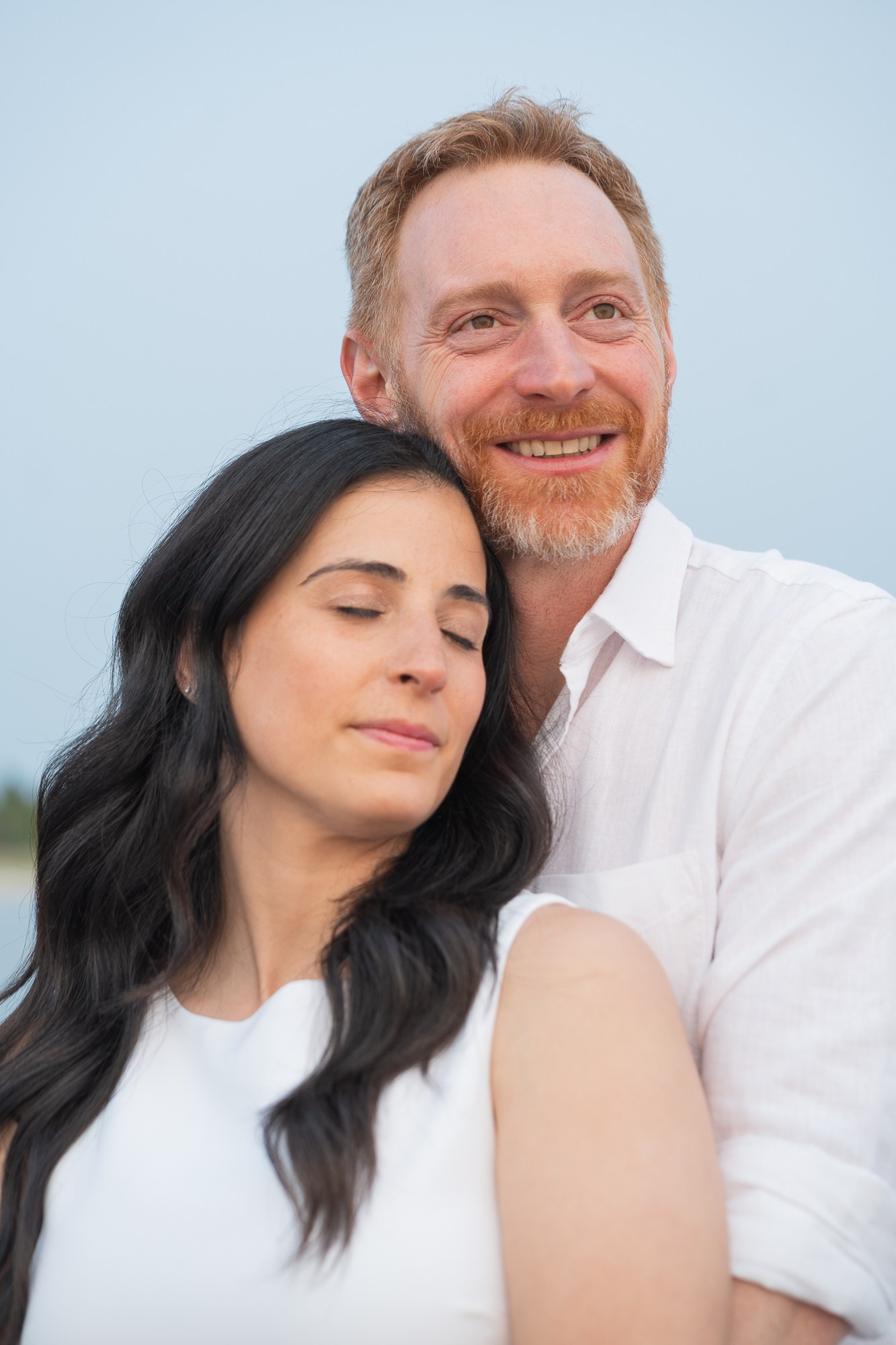 Minimalist portrait of an engaged couple in soft neutral tones — simple and elegant