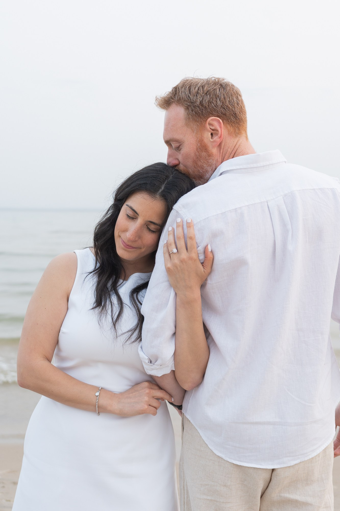 Minimalist portrait of an engaged couple in soft neutral tones — simple and elegant