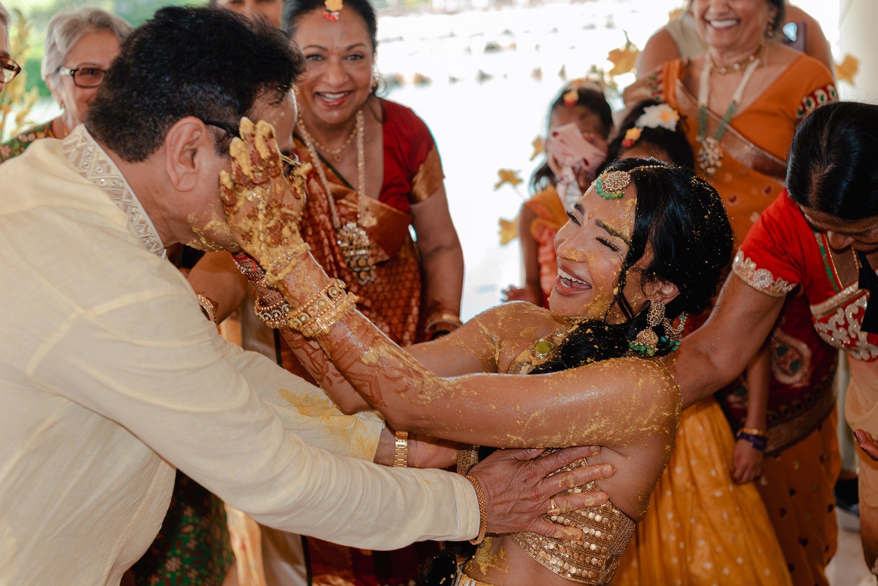 Traditional Haldi ceremony moment of Indian bride at a multi-day wedding celebration in Mexico