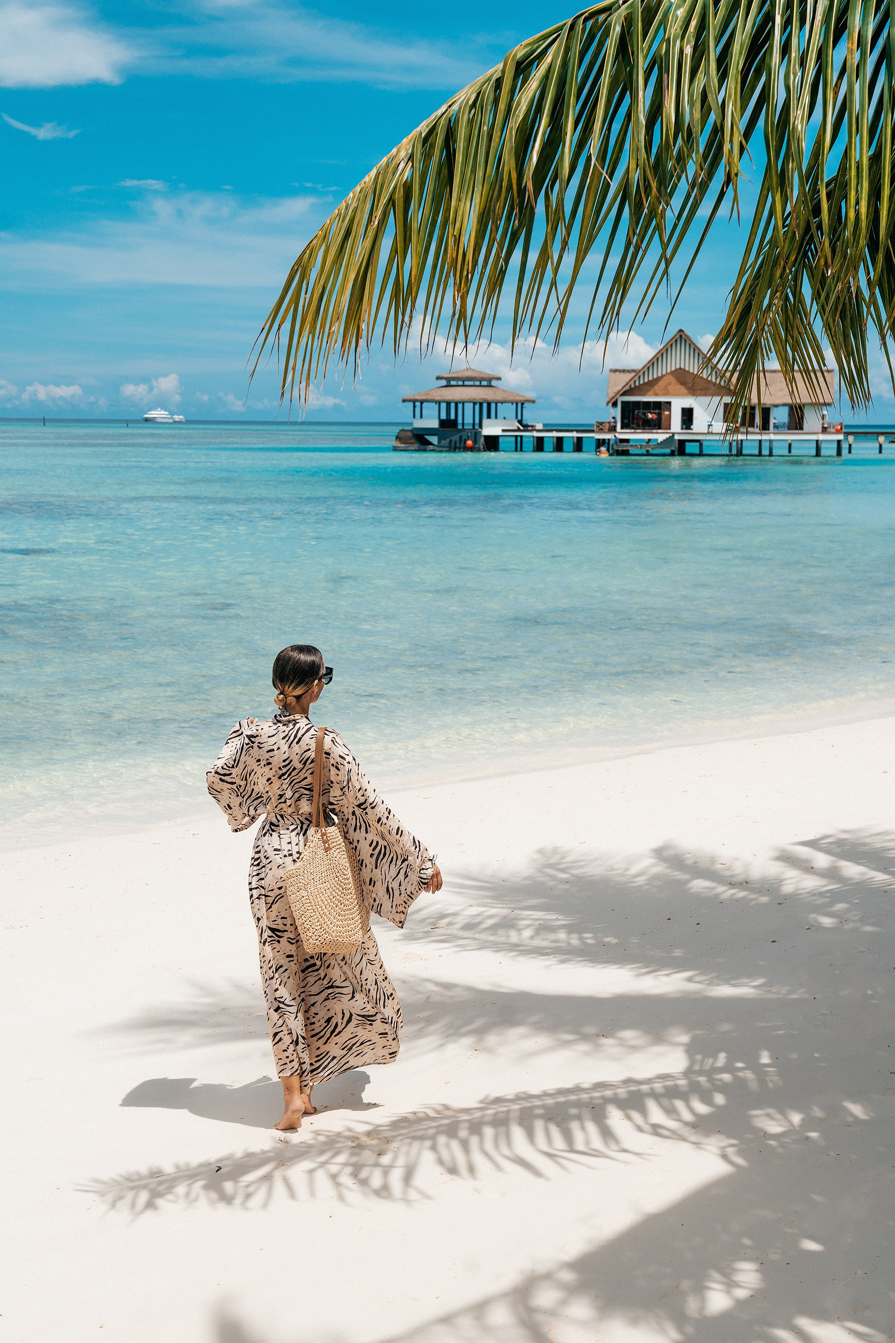 Lifestyle photography for a resortwear brand featuring a relaxed holiday look in the Maldives