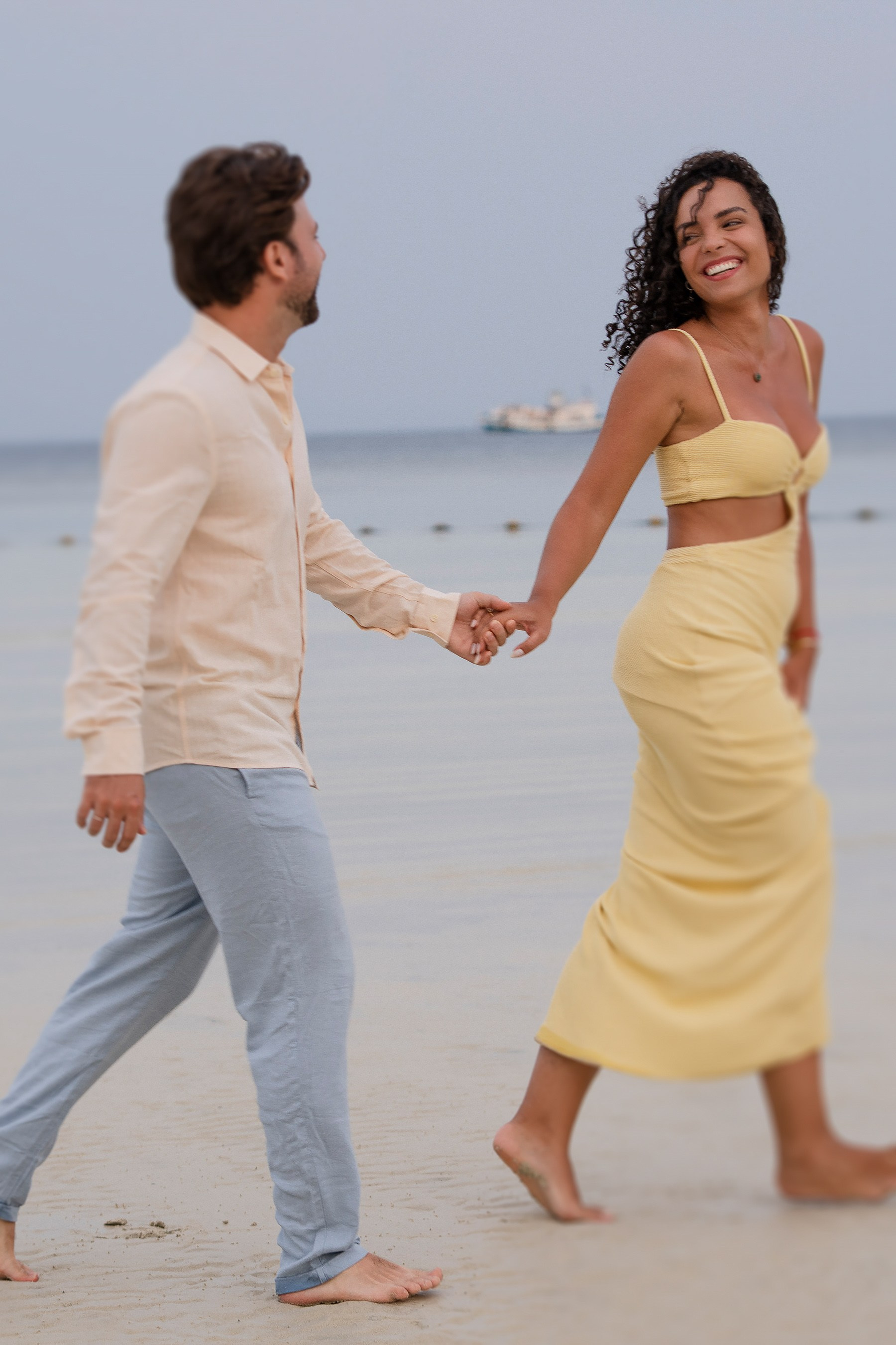 Romantic couple photography in Phuket featuring a couple walking together on a tropical beach