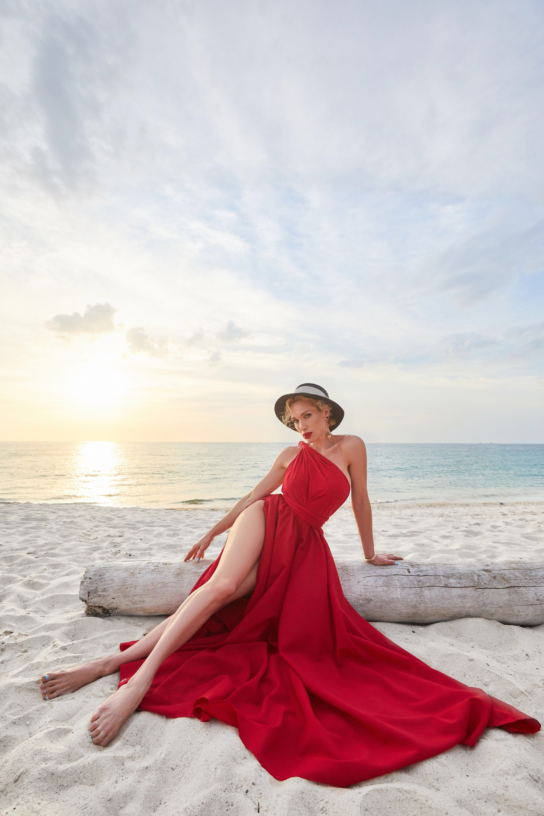 Luxury portrait experience in Phuket featuring an elegant woman on a tropical beach