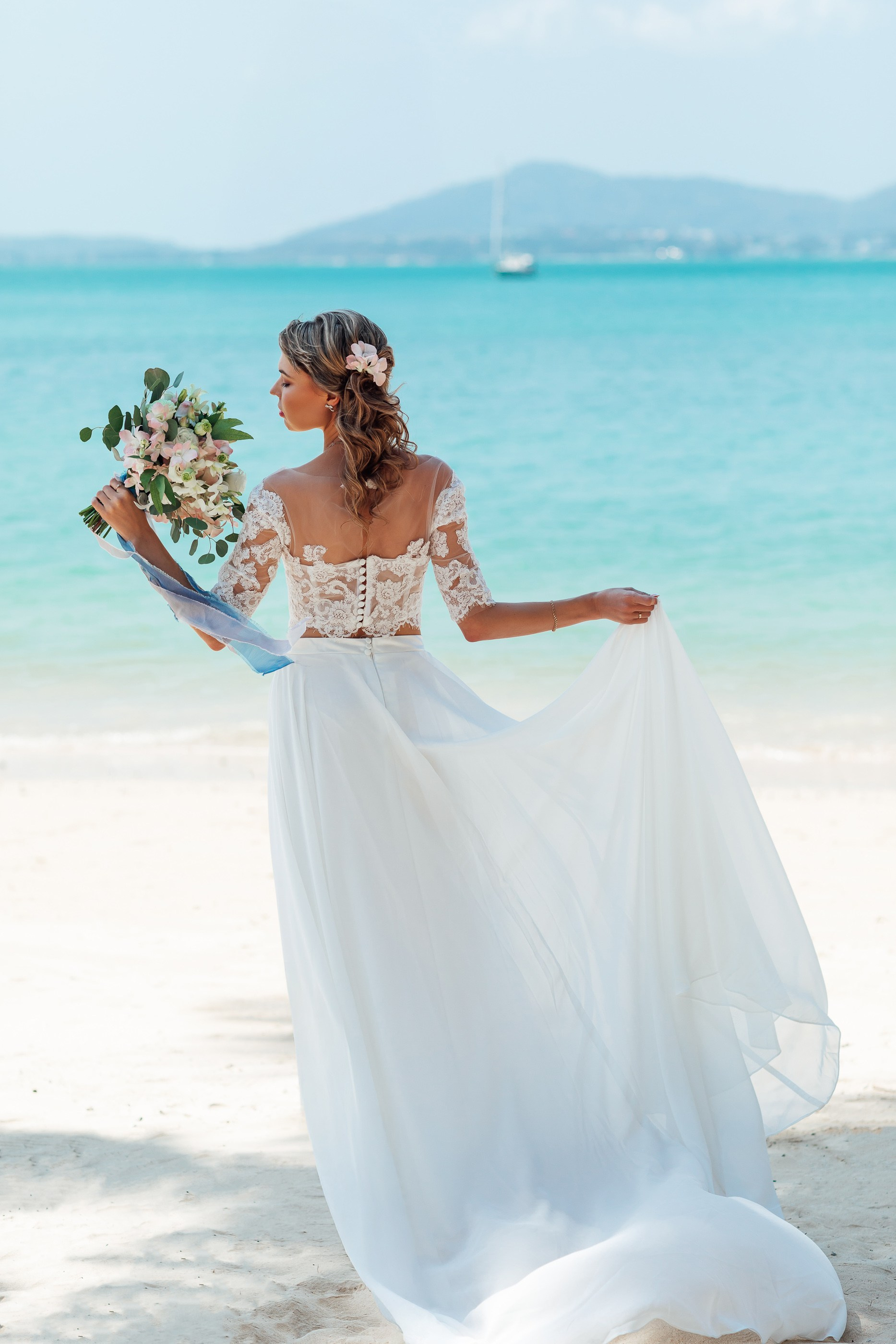 Bride portrait photography in Phuket capturing an elegant bridal look against a tropical beach backdrop