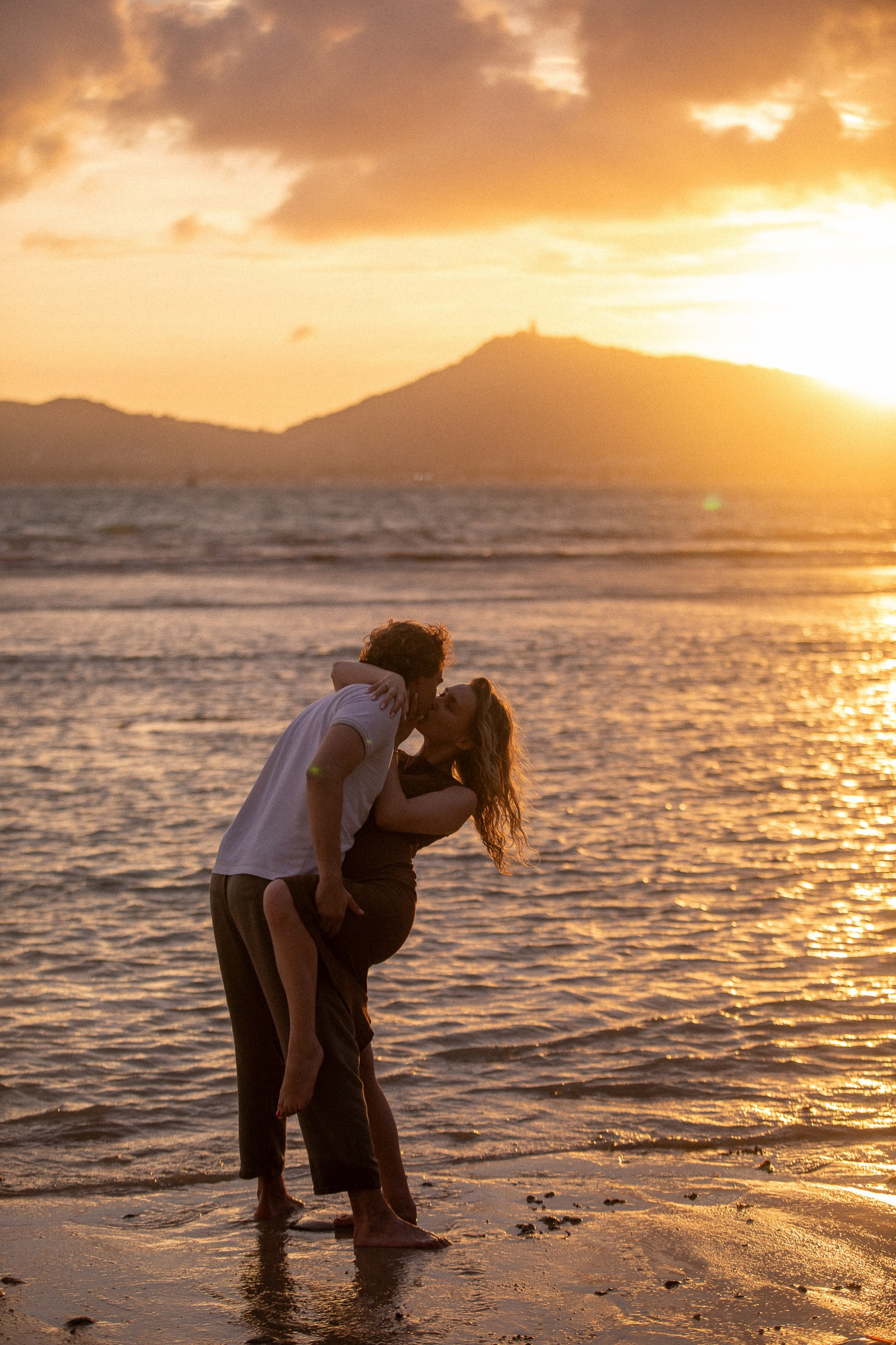 Tropical lifestyle couple photography in Phuket capturing a relaxed and romantic moment by the sea at sunset