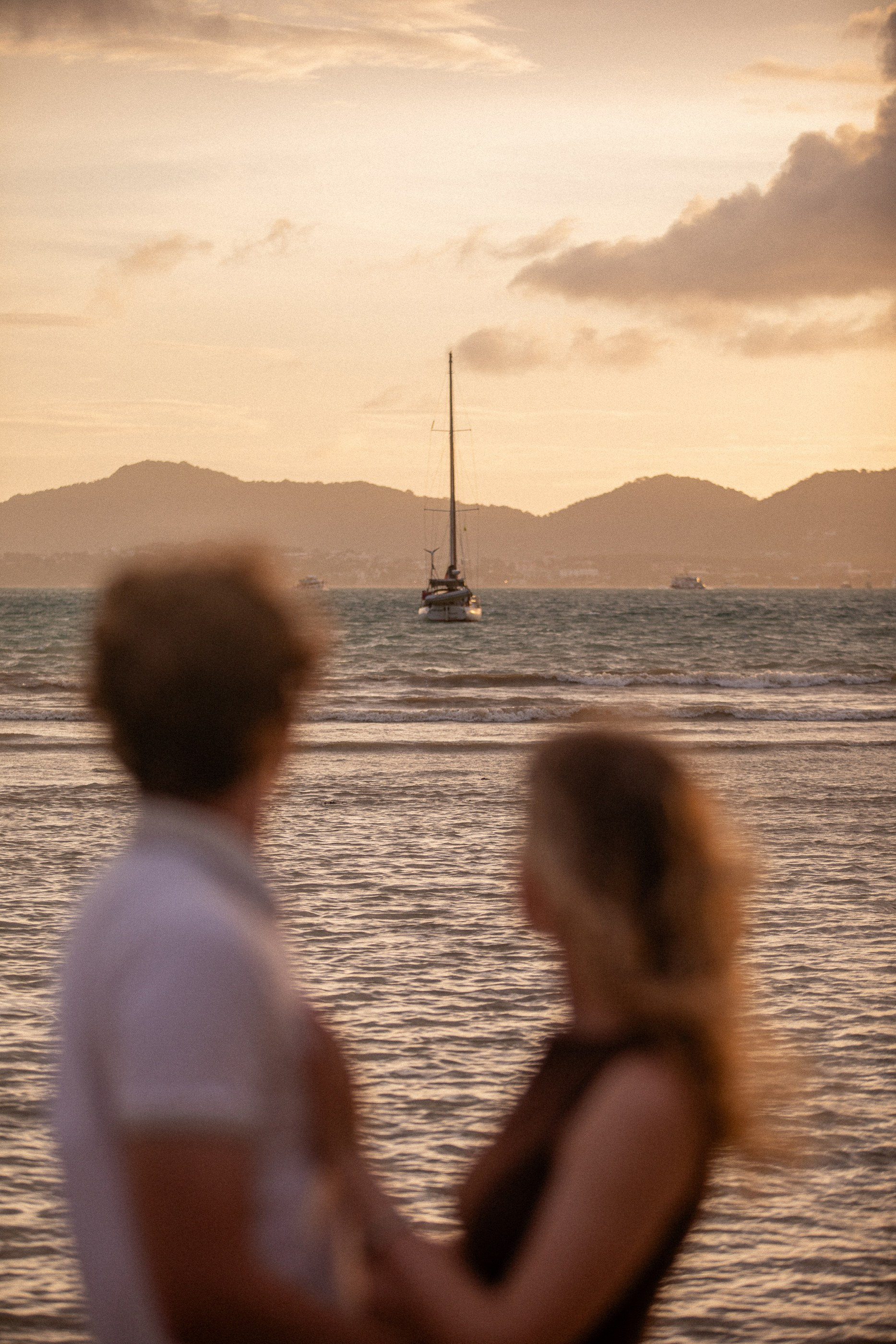 Luxury couple photography in Phuket with an intimate beach setting and tropical mountain views