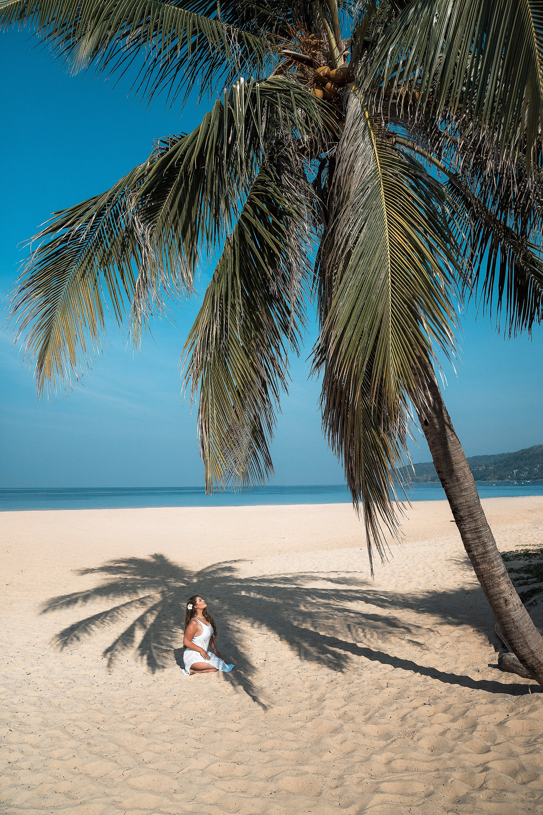 Fine art luxury photography in Phuket combining an elegant portrait with tropical island scenery