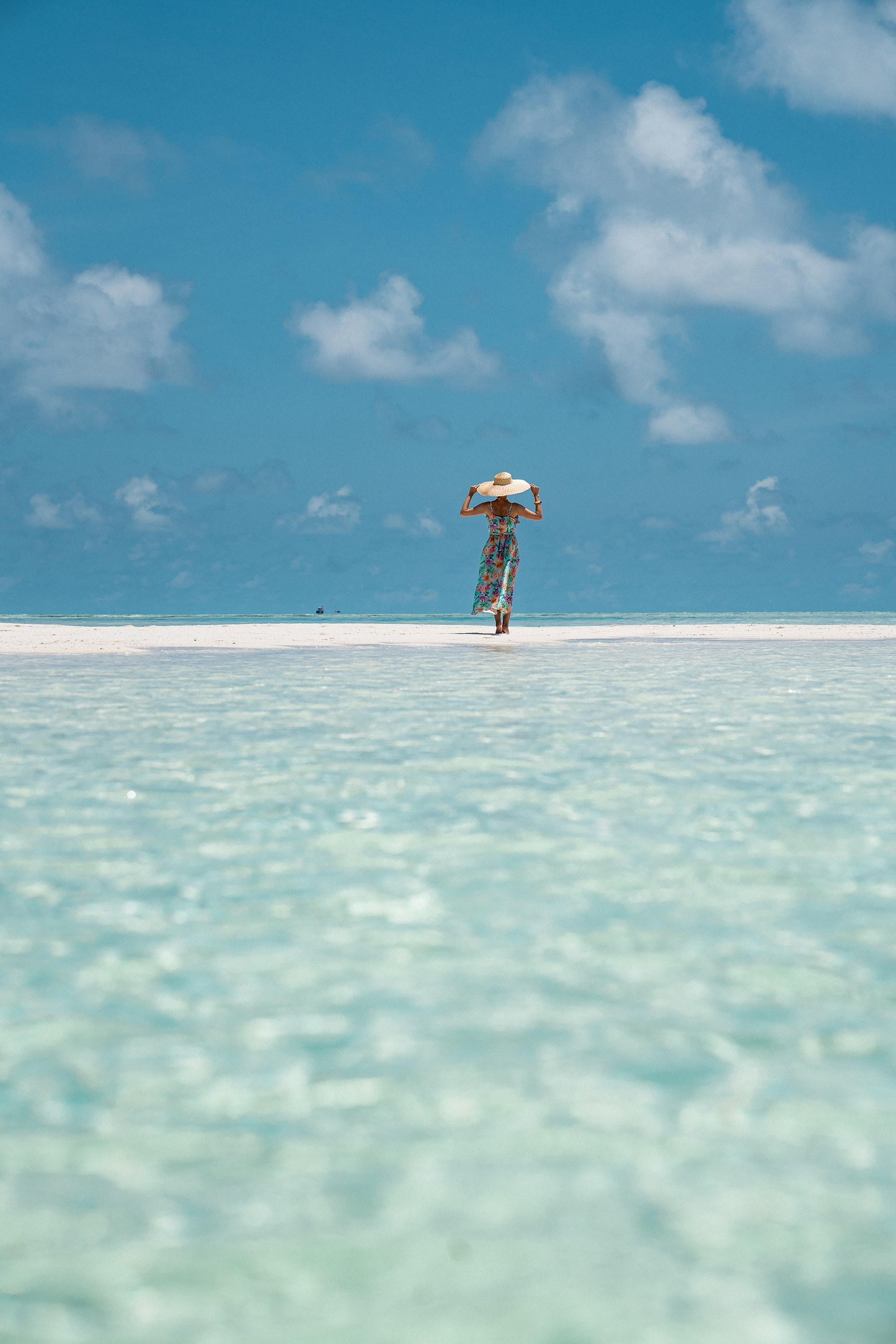 Luxury beachwear photography with a model posing beside the sea