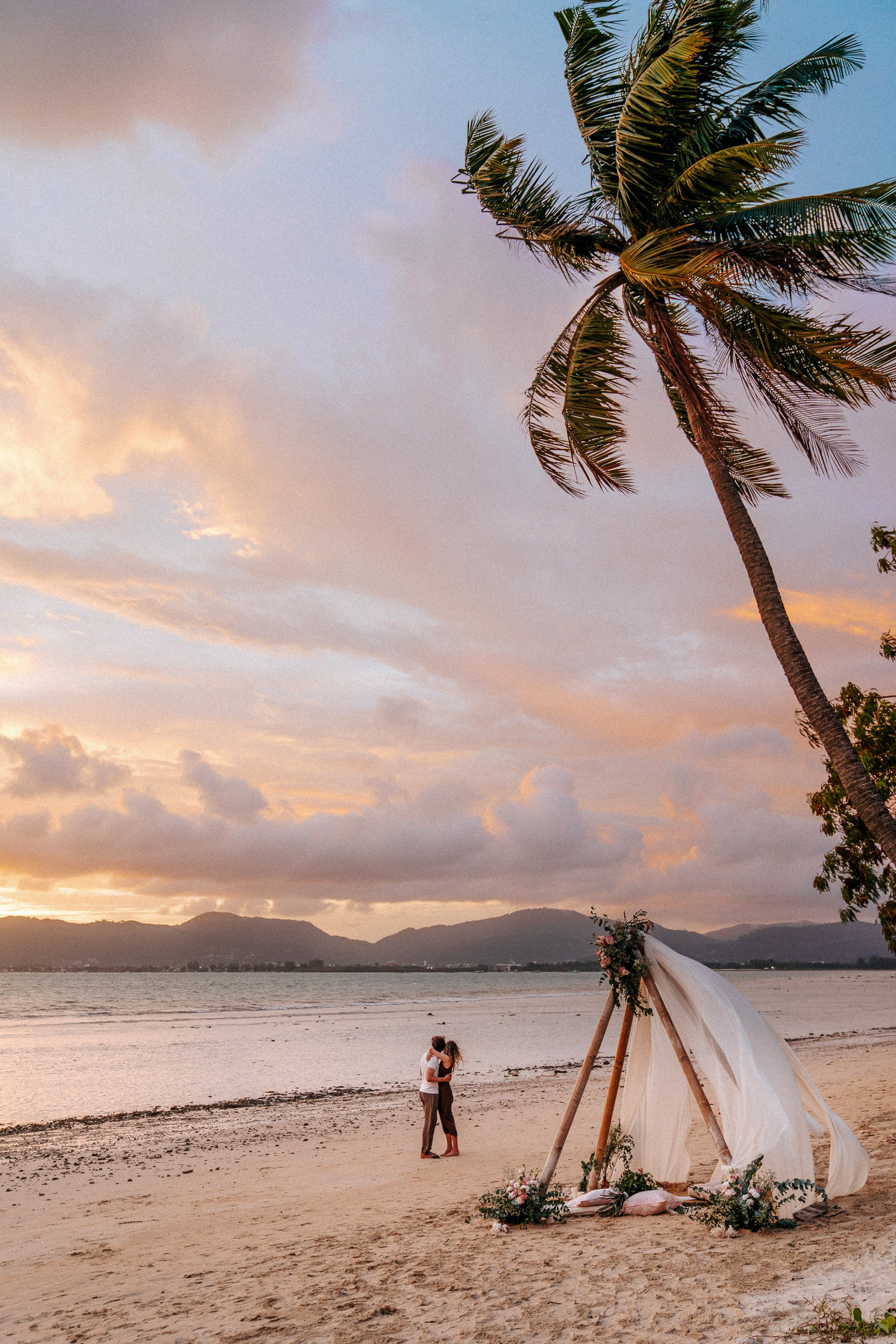 Fine art wedding photography in Phuket with a romantic couple portrait on a tropical coastline