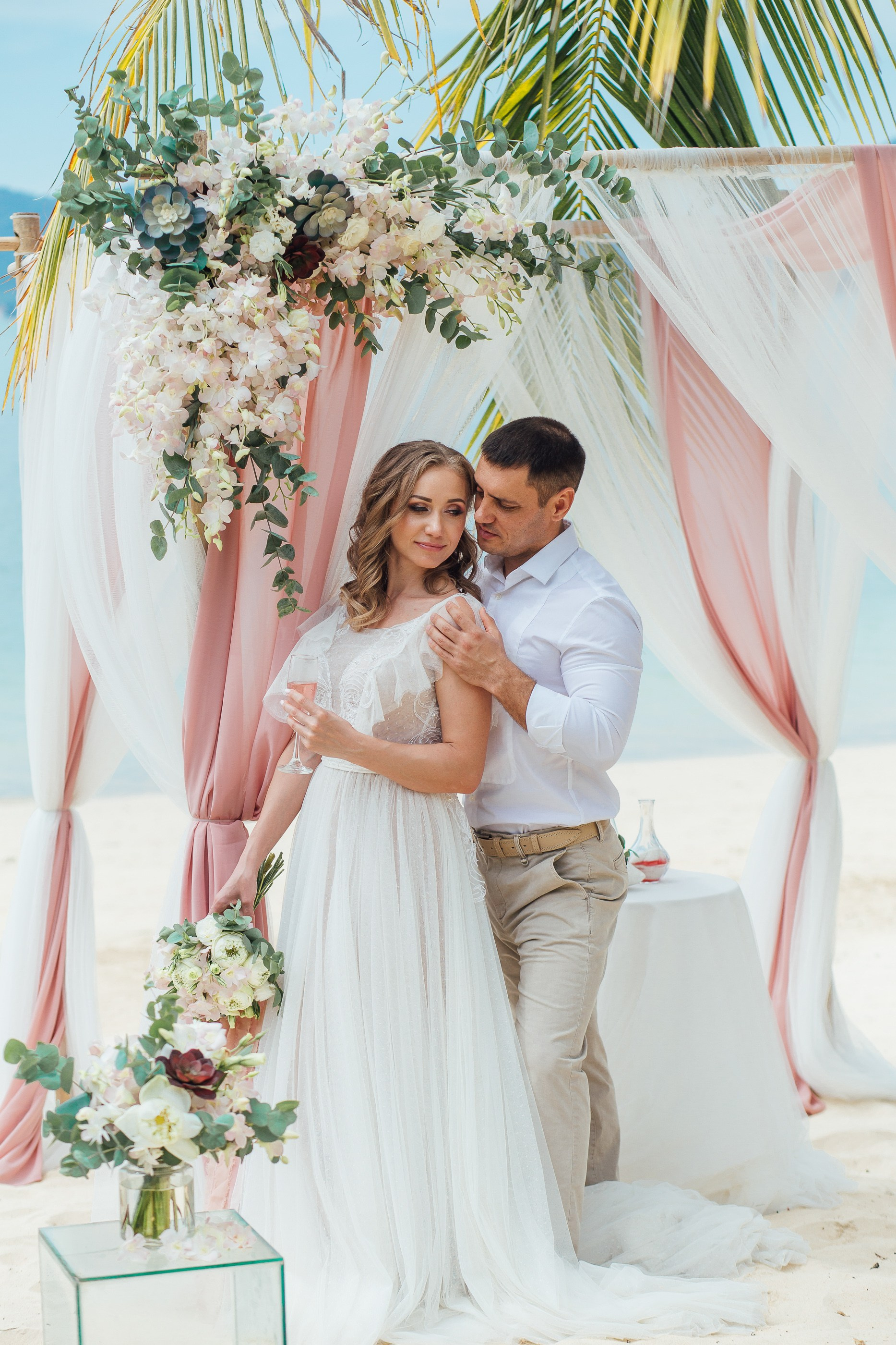Destination wedding portraits in Phuket capturing the bride and groom in an elegant tropical setting