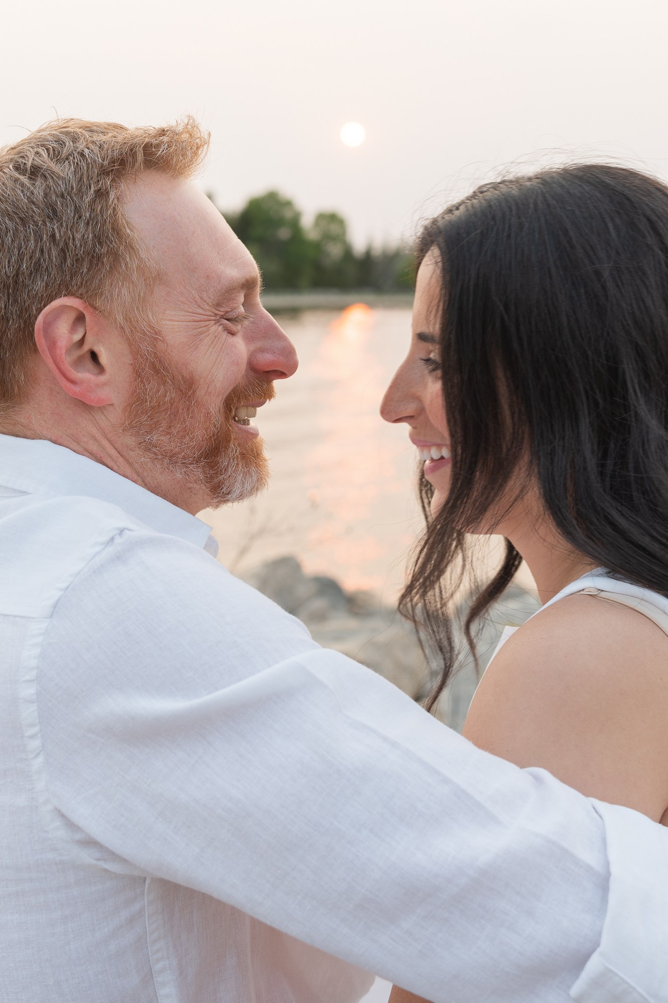 Minimalist portrait of an engaged couple in soft neutral tones — simple and elegant
