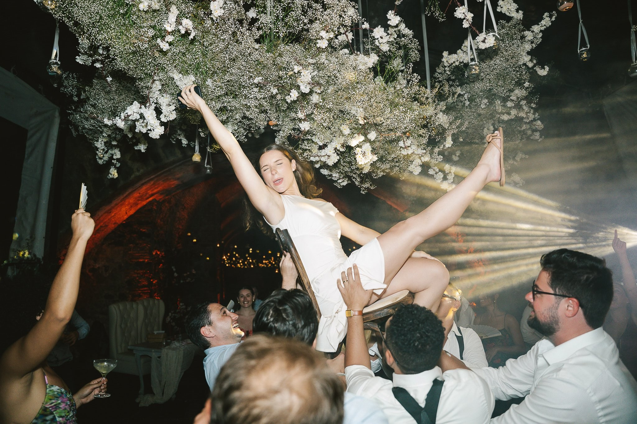 Guests dancing and celebrating at the wedding reception in Hacienda San Antonio El Puente