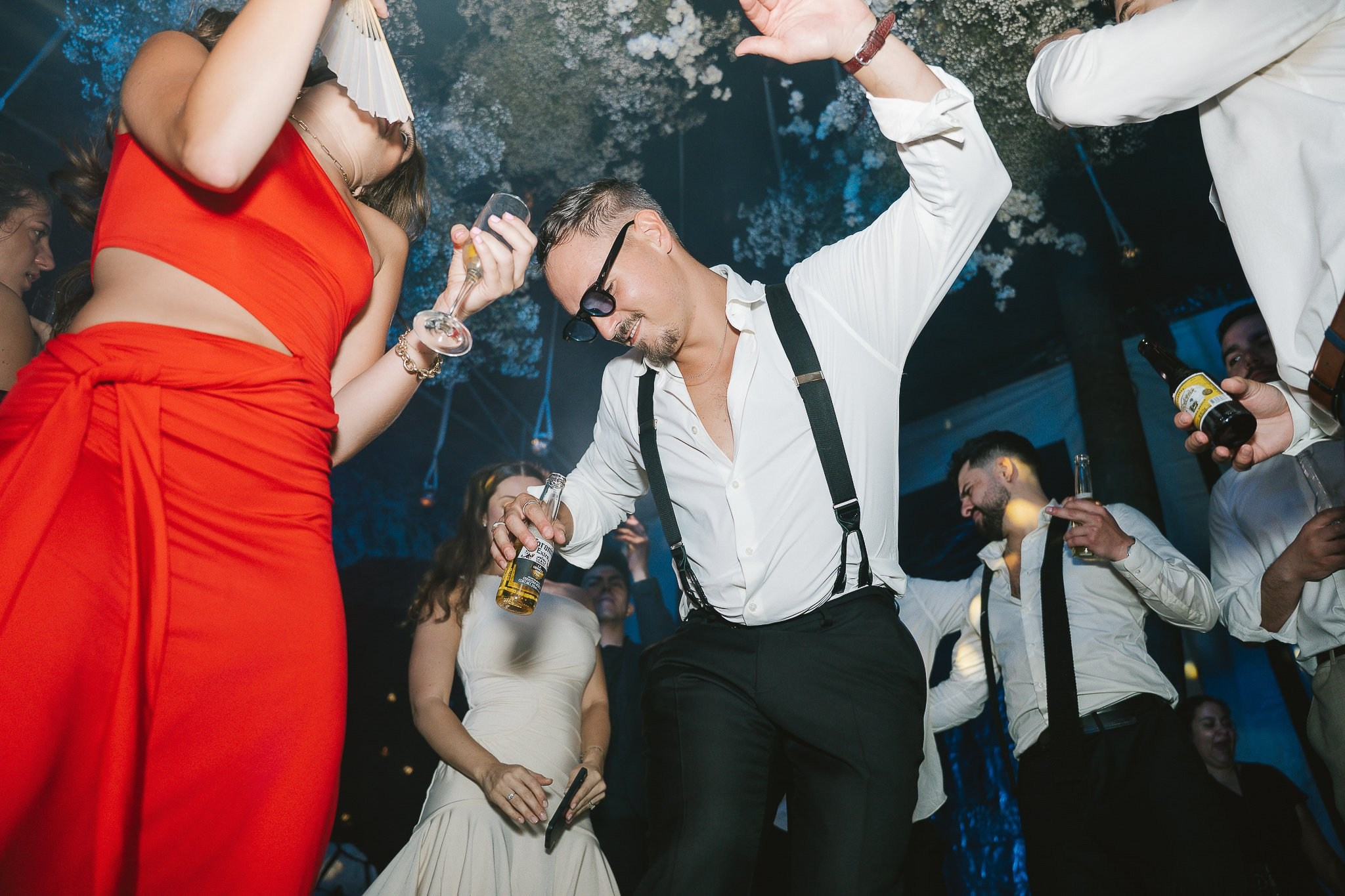 Guests dancing and celebrating at the wedding reception in Hacienda San Antonio El Puente