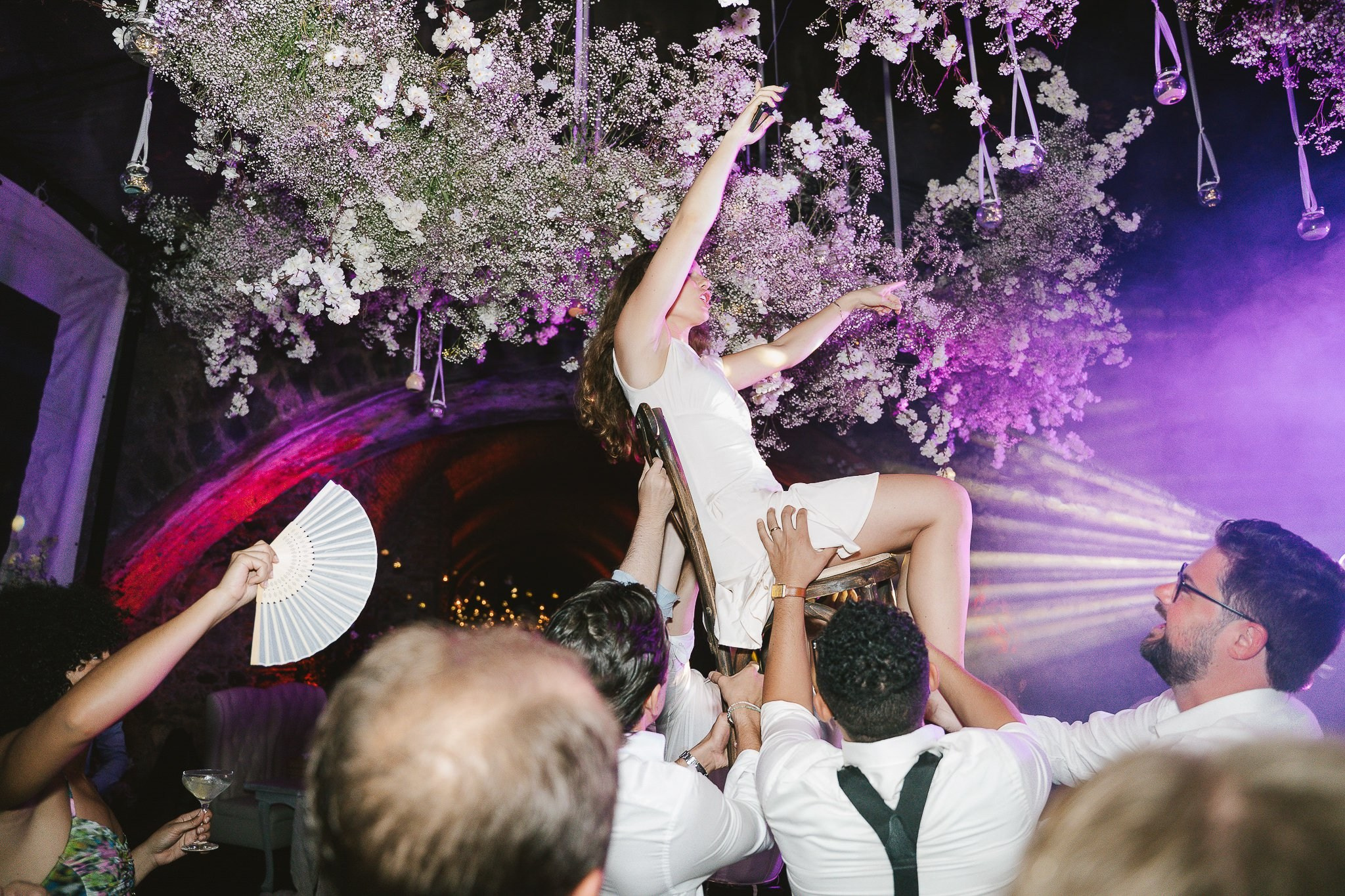 Guests dancing and celebrating at the wedding reception in Hacienda San Antonio El Puente