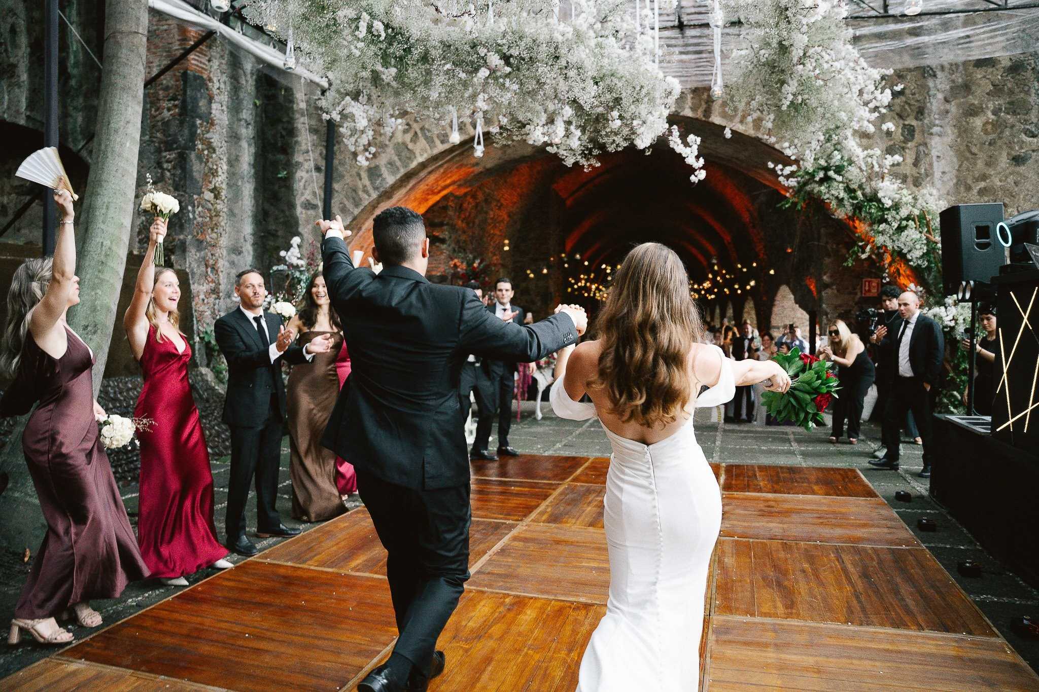 Guests dancing and celebrating at the wedding reception in Hacienda San Antonio El Puente