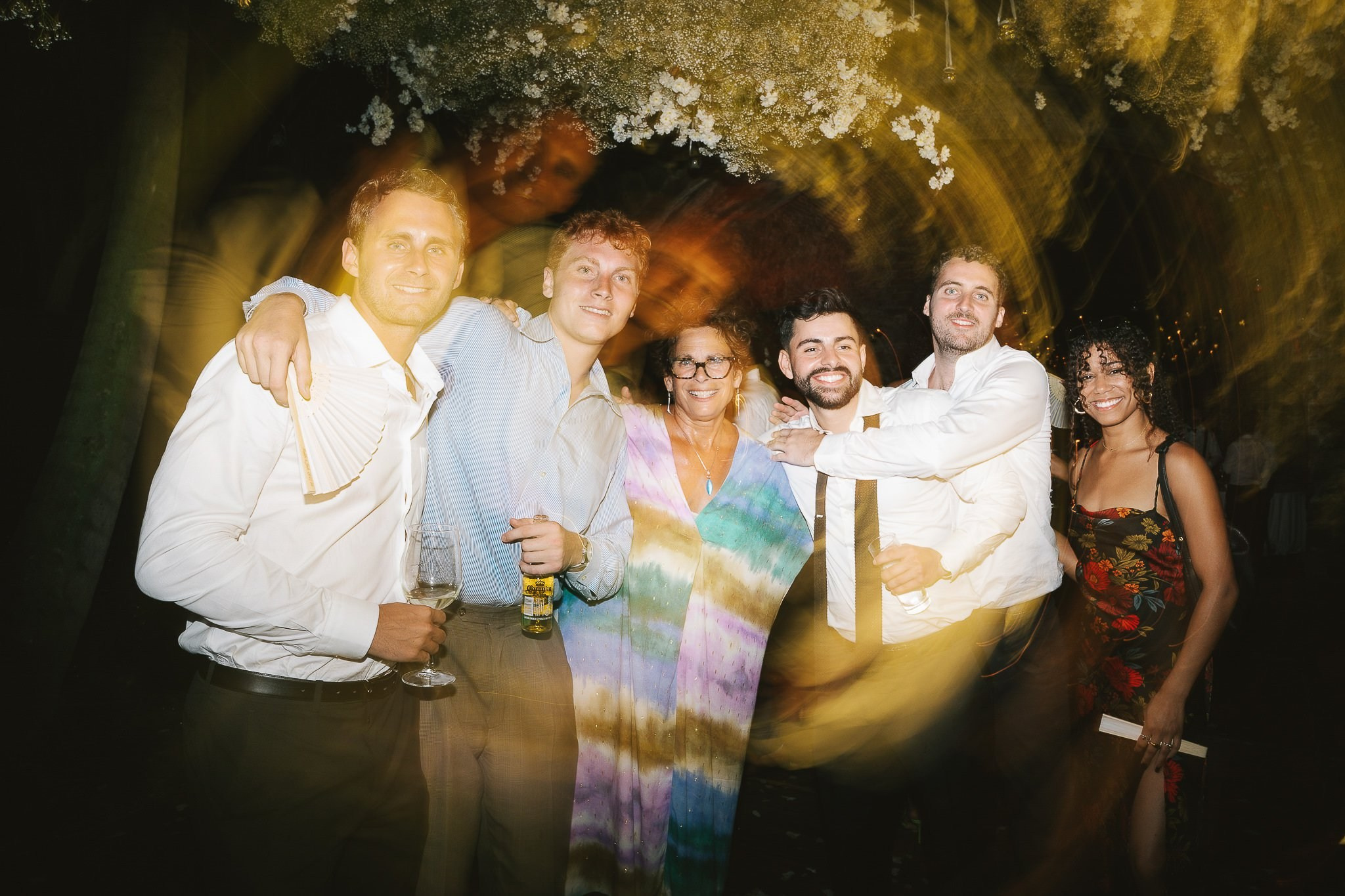 Guests dancing and celebrating at the wedding reception in Hacienda San Antonio El Puente