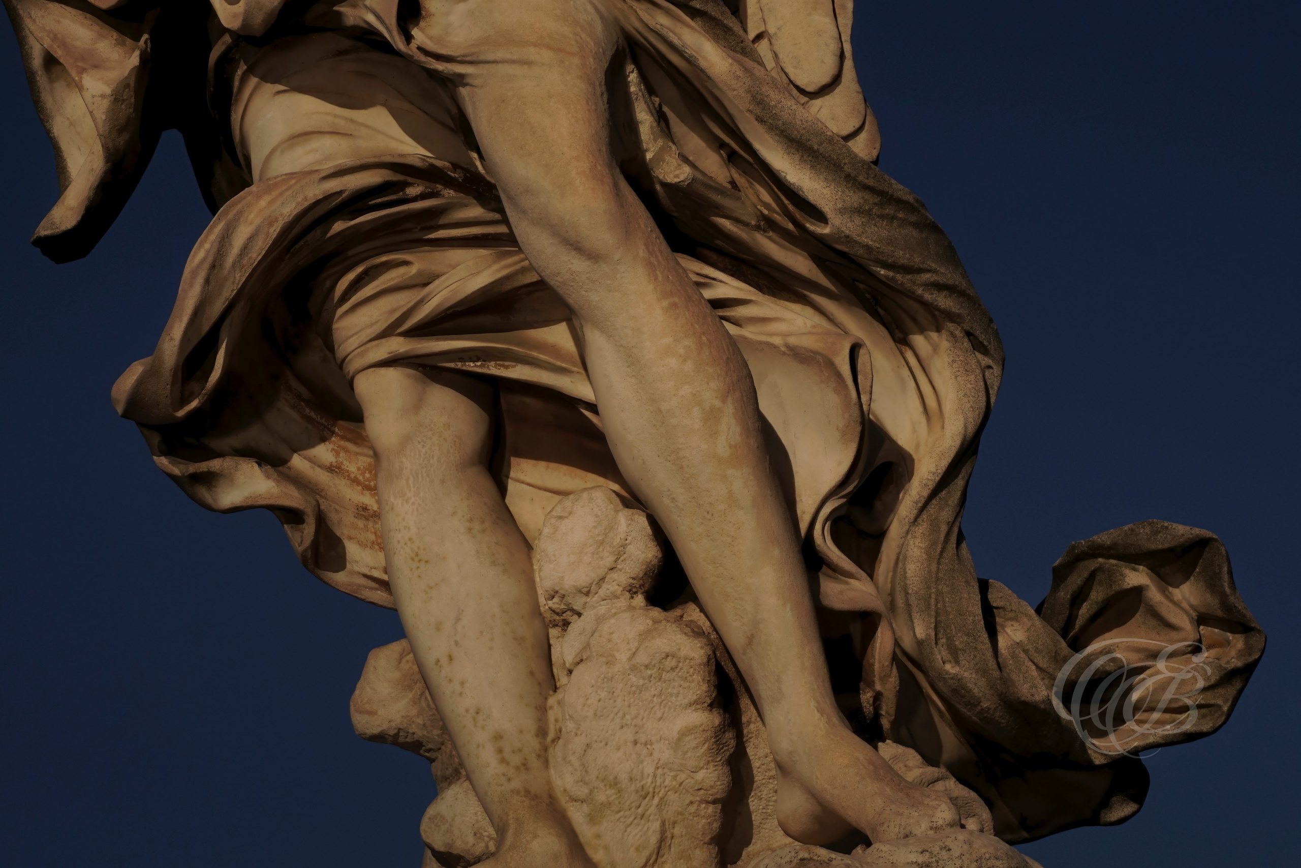 Rome, Italy—Angel’s Feet at Ponte Sant’Angelo—Eduardo Bartoli Photography—Photograph of a detail from the angel sculptures on Ponte Sant’Angelo, seventeenth-century works based on designs by Gian Lorenzo Bernini on the historic bridge completed in AD 134—Rome, Italy—Angel’s Feet at Ponte Sant’Angelo—Eduardo Bartoli Photography.