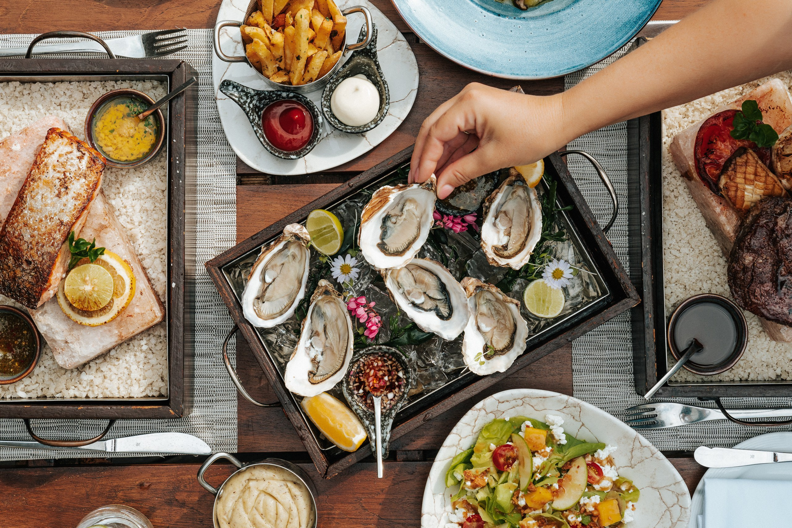 Editorial oyster photography showcasing fresh seafood beautifully presented at a luxury hotel restaurant