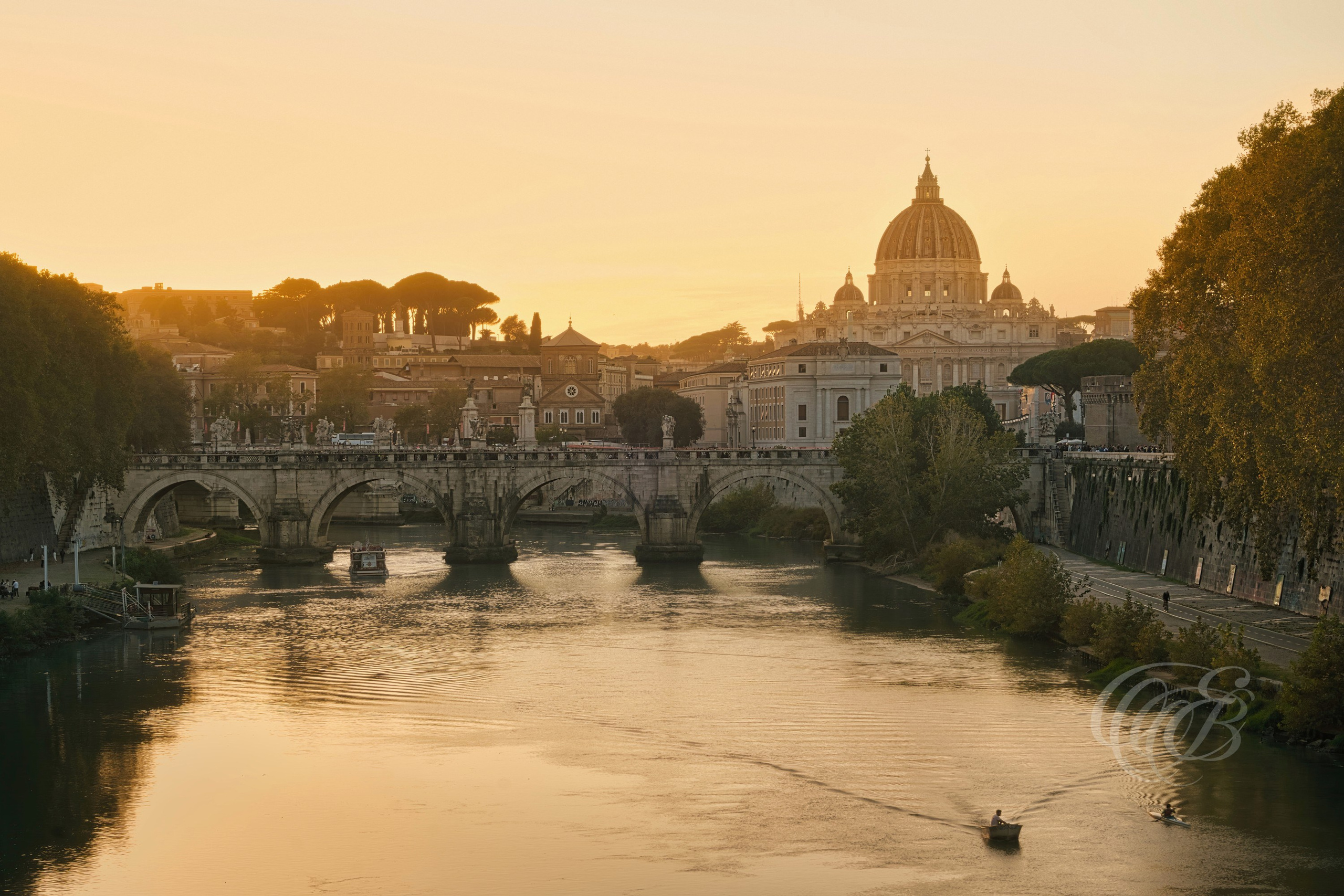 Rome, Italy—Ponte Sant’Angelo & Saint Peter’s Dome—Eduardo Bartoli Photography—Photograph of Ponte Sant’Angelo and the dome of St. Peter’s Basilica, historic landmarks associated with pilgrimage routes to the Vatican and Renaissance architecture in Rome, Italy—Rome, Italy—Ponte Sant’Angelo & Saint Peter’s Dome—Eduardo Bartoli Photography.