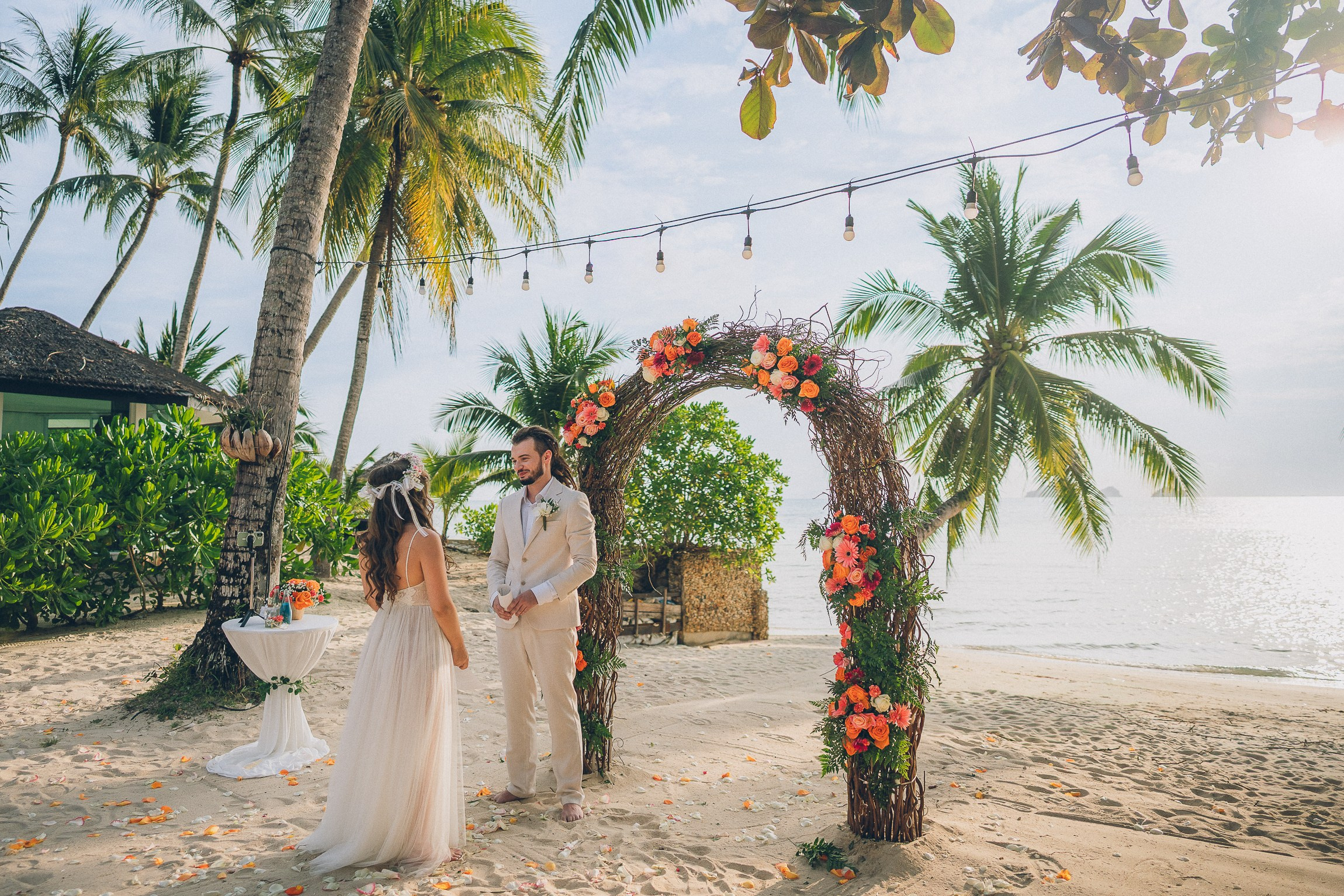 Romantic escape wedding ceremony for two on a secluded beach in Koh Samui, Thailand at sunset