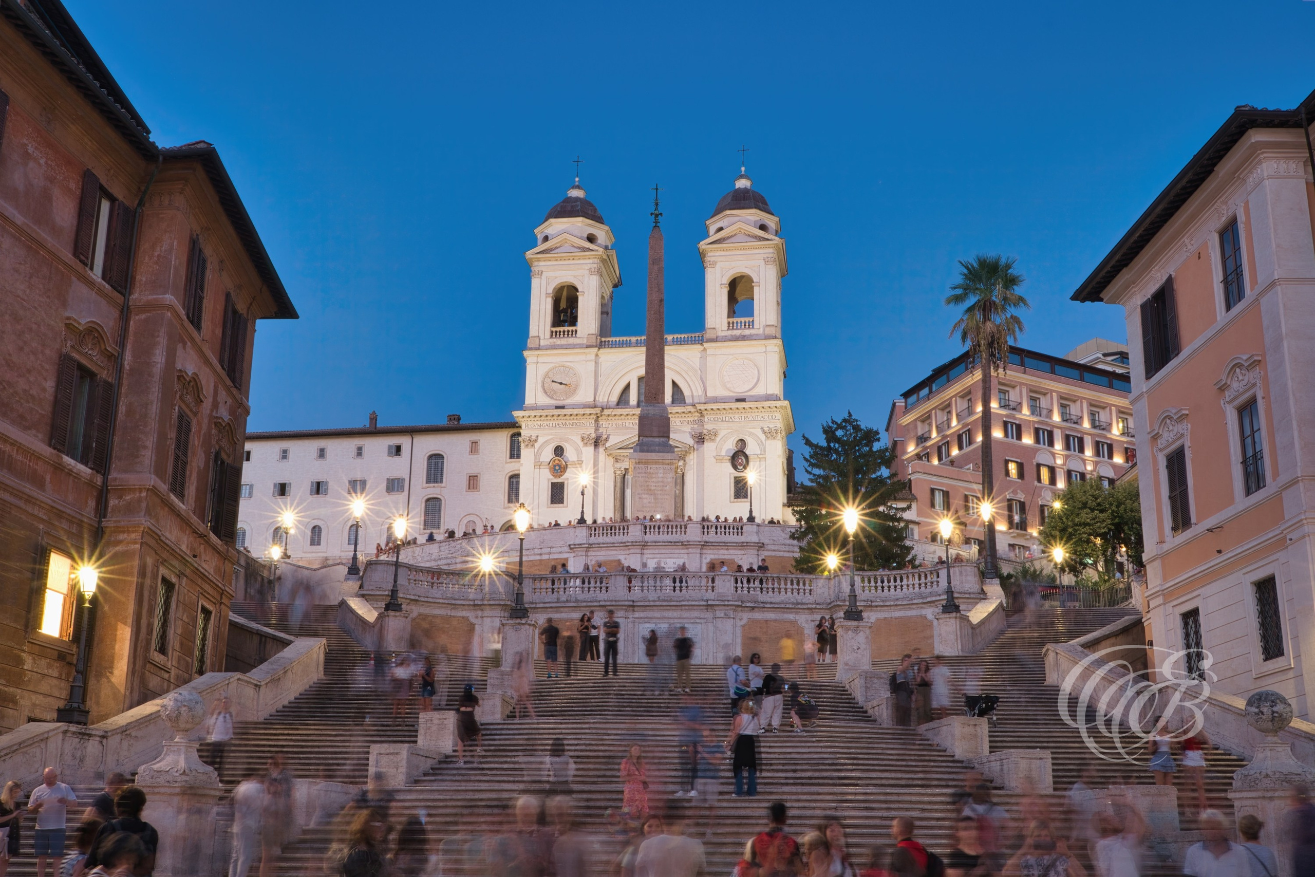 ITALY TRAVEL PHOTOGRAPHY – ITALY – ROME — Spanish Steps at Dusk — Historic staircase connecting Piazza di Spagna to Trinità dei Monti church, illuminated by evening light in central Rome, Italy — Eduardo Bartoli Photography.