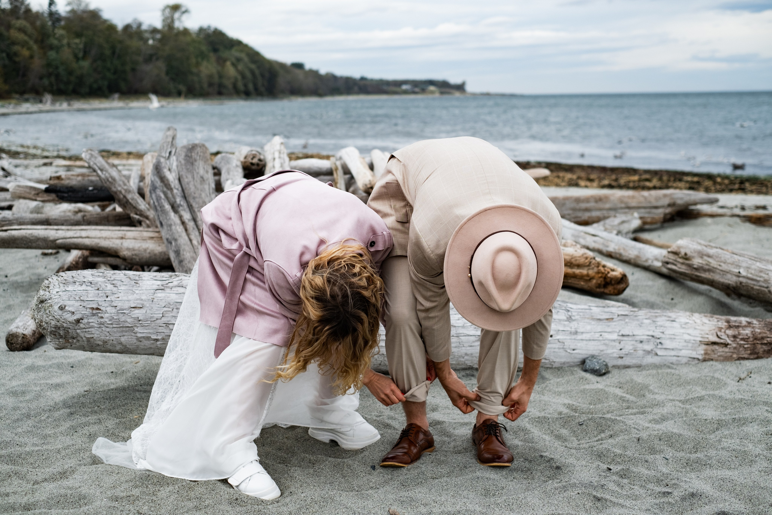 bride and groom framed by natural landscape