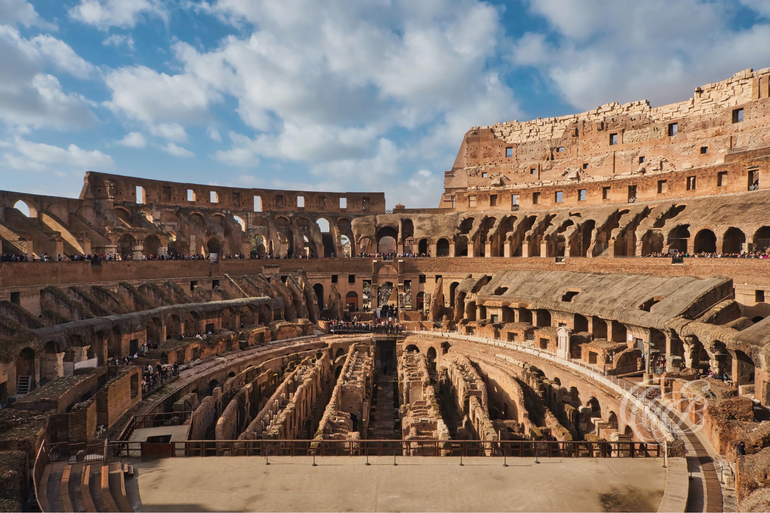 ITALY TRAVEL PHOTOGRAPHY – ITALY – ROME — Interior View of the Colosseum — Interior architecture of the ancient Roman amphitheater showing vaulted corridors, arches, and structural remains, Rome, Italy — Eduardo Bartoli Photography.