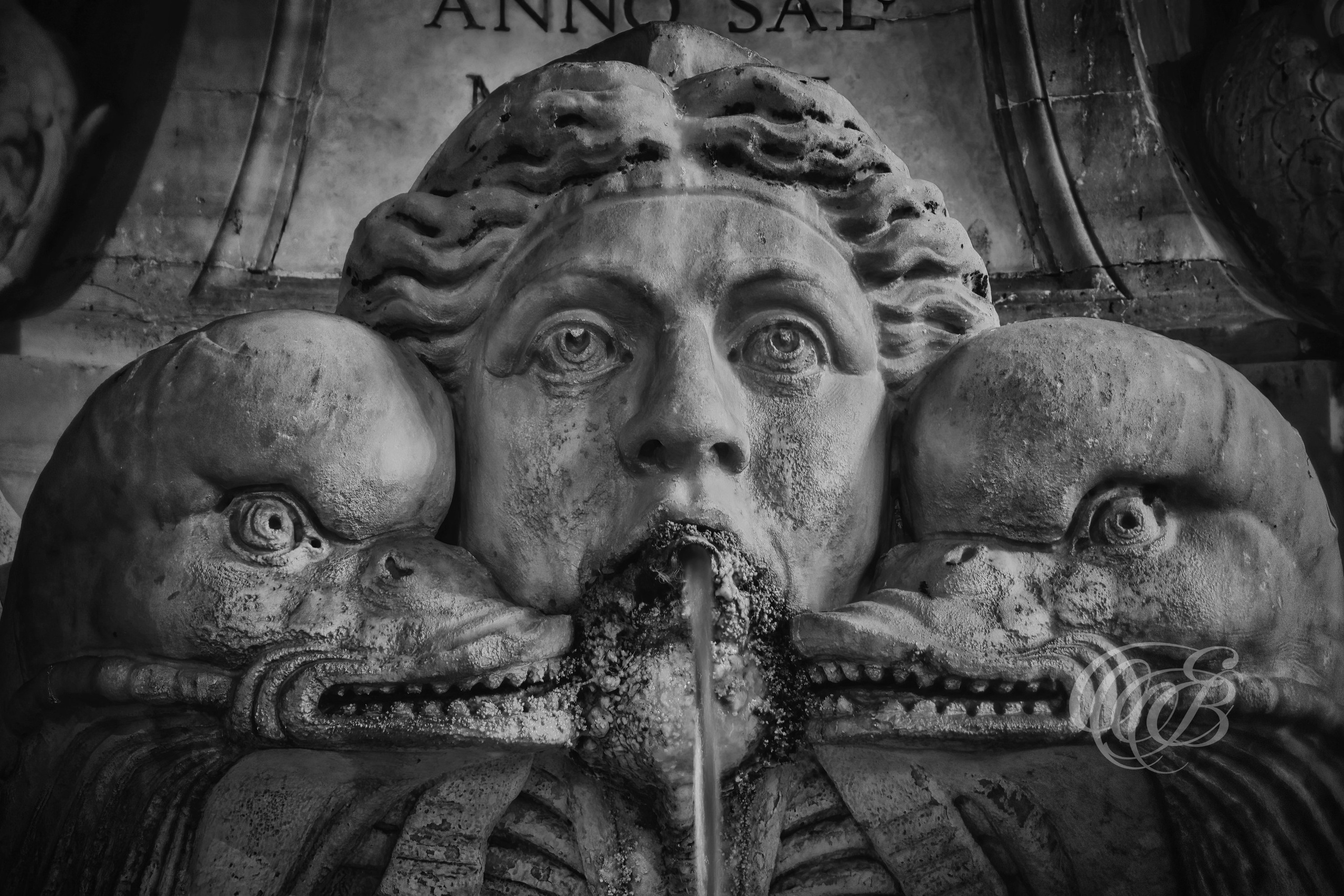 Rome Italy - Sculpture in the Fountain in front of the Pantheon - B&W - Eduardo Bartoli Fine Art Photography - Black and white photograph of a sculpture in the fountain in front of the Pantheon in Rome, Italy – fine art photography by Eduardo Bartoli.