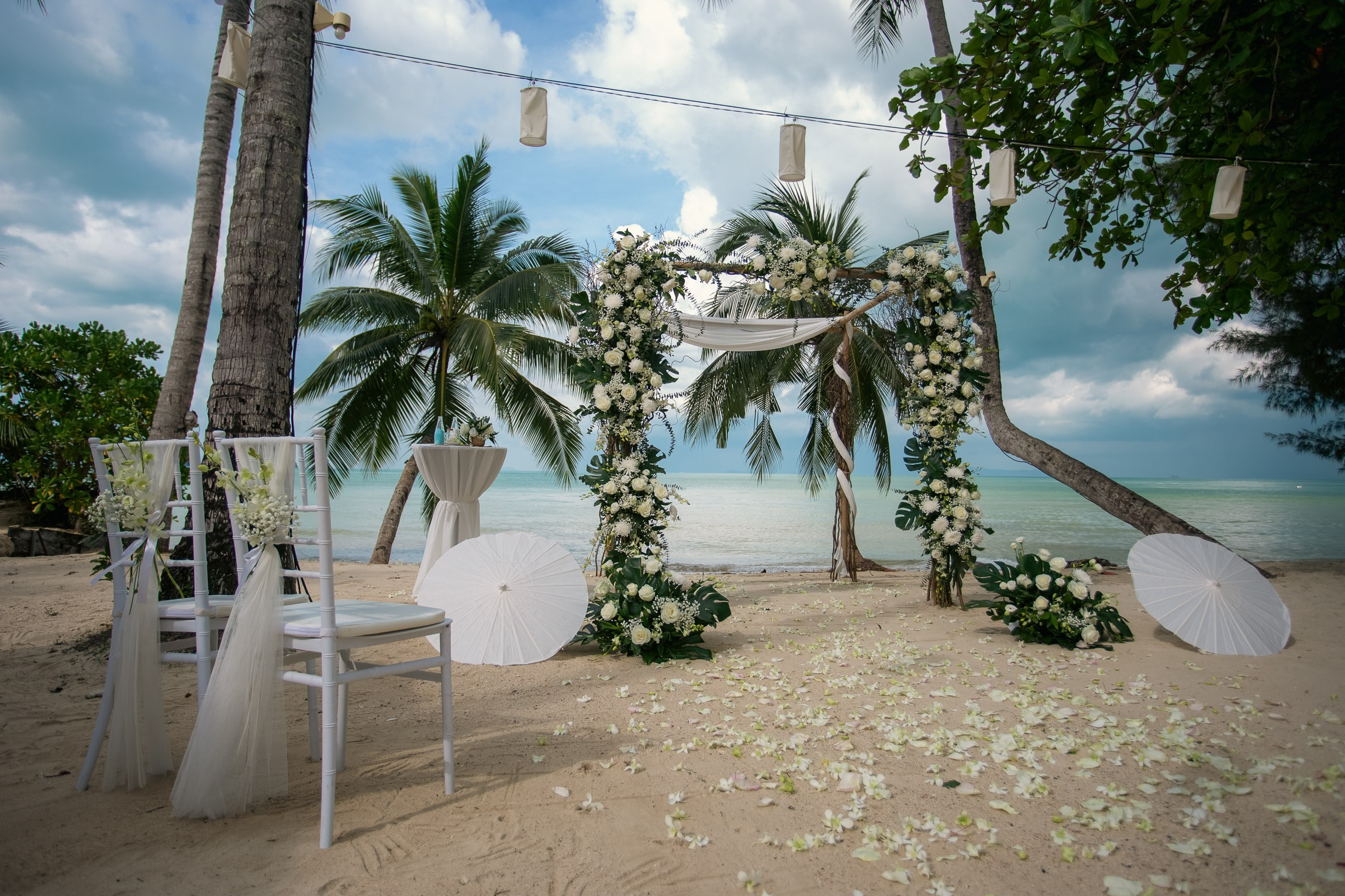 Elegant escape wedding for two on a beautiful beach in Koh Samui, Thailand with romantic wedding decorations