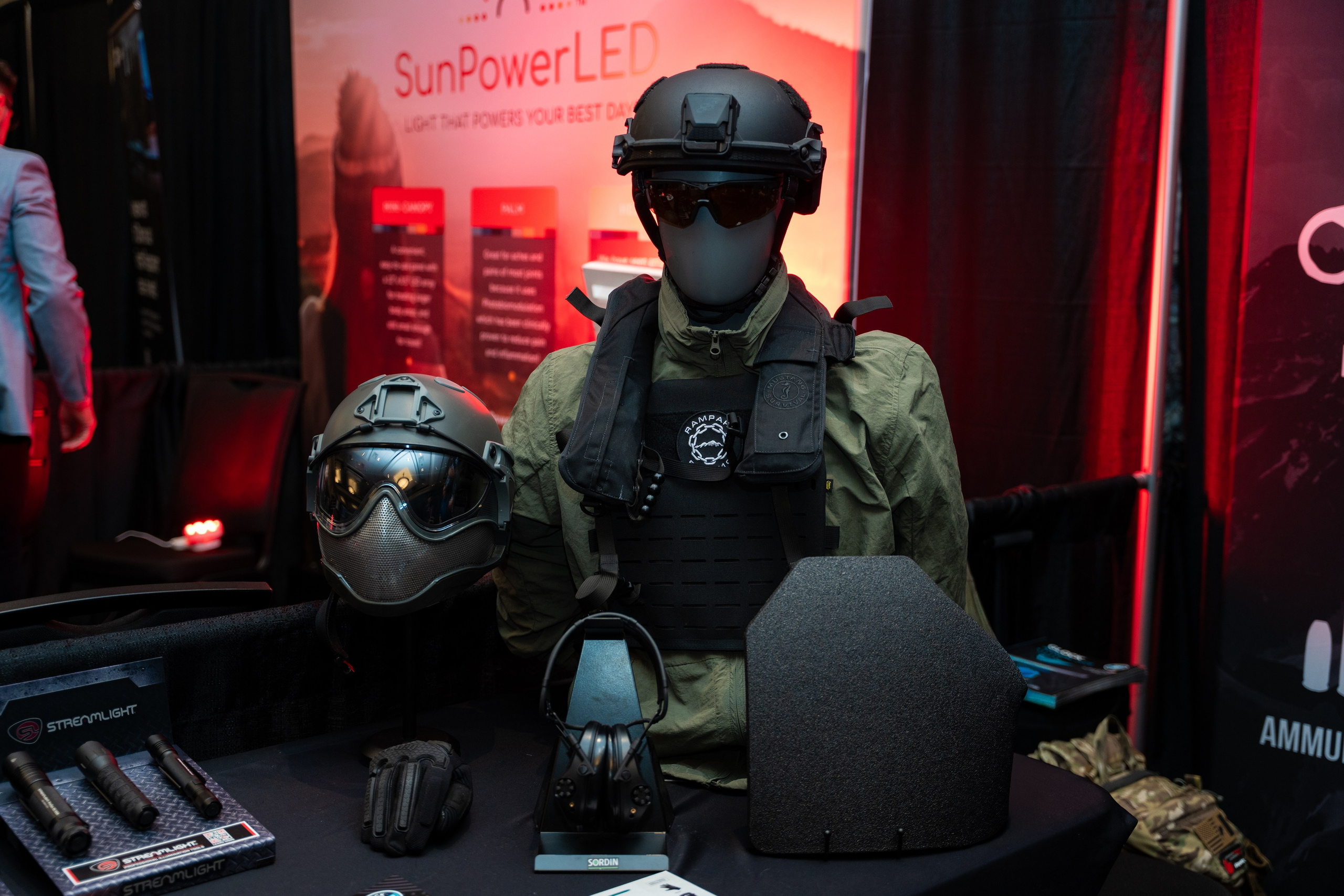 Attendee wearing green tactical helmet, Blueline Expo 2026