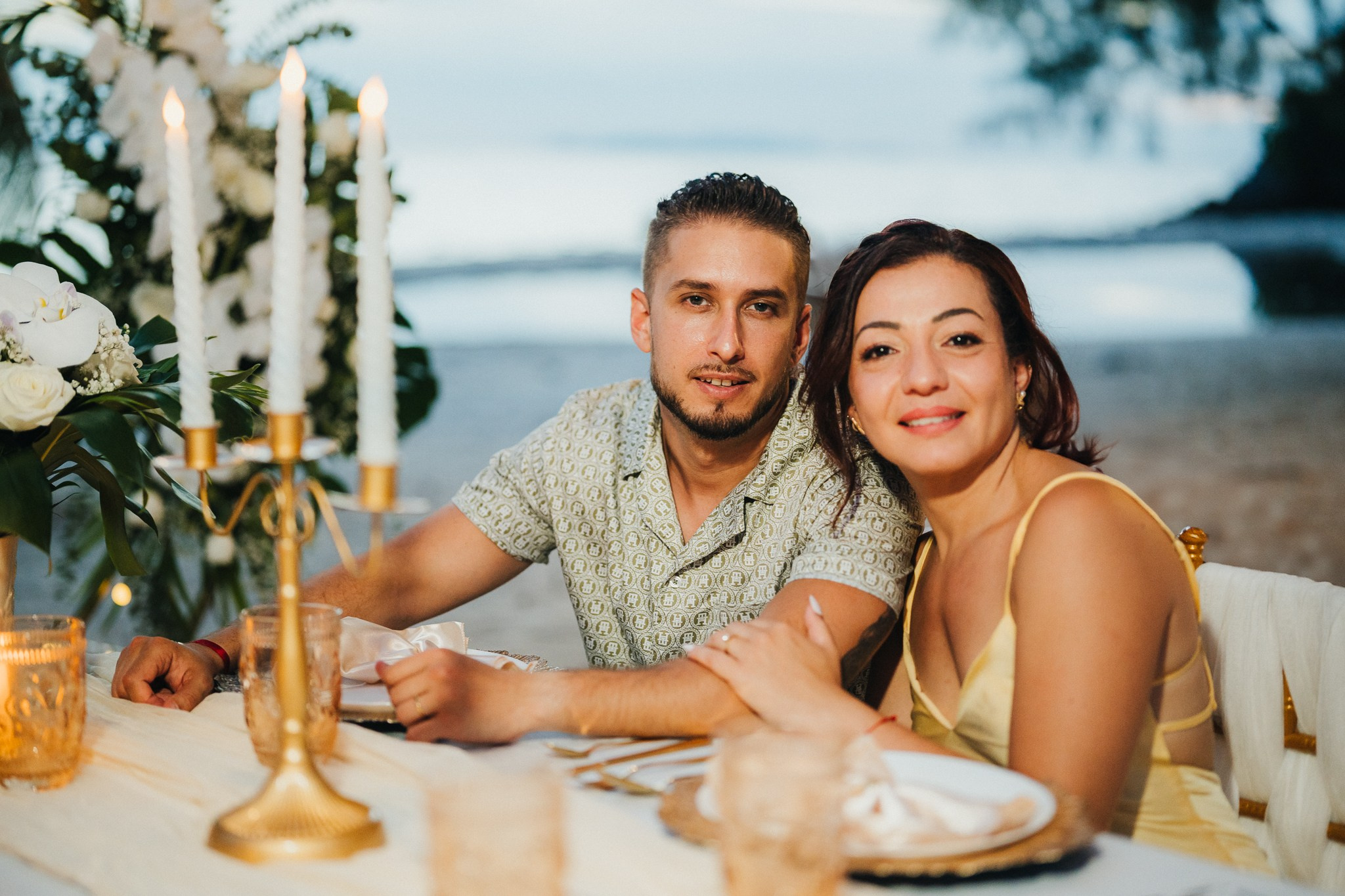 Intimate family wedding on the beach in Koh Samui, Thailand with the couple and their children enjoying the ceremony together