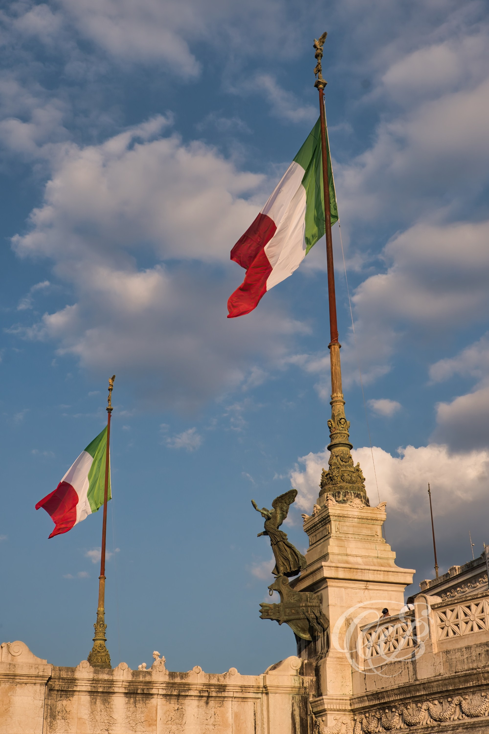 ITALY TRAVEL PHOTOGRAPHY – ITALY – ROME — Monument to Victor Emmanuel II at Sunset — Travertine national monument in Piazza Venezia showing sculptural reliefs and architectural details illuminated by evening light, Rome, Italy — Eduardo Bartoli Photography.