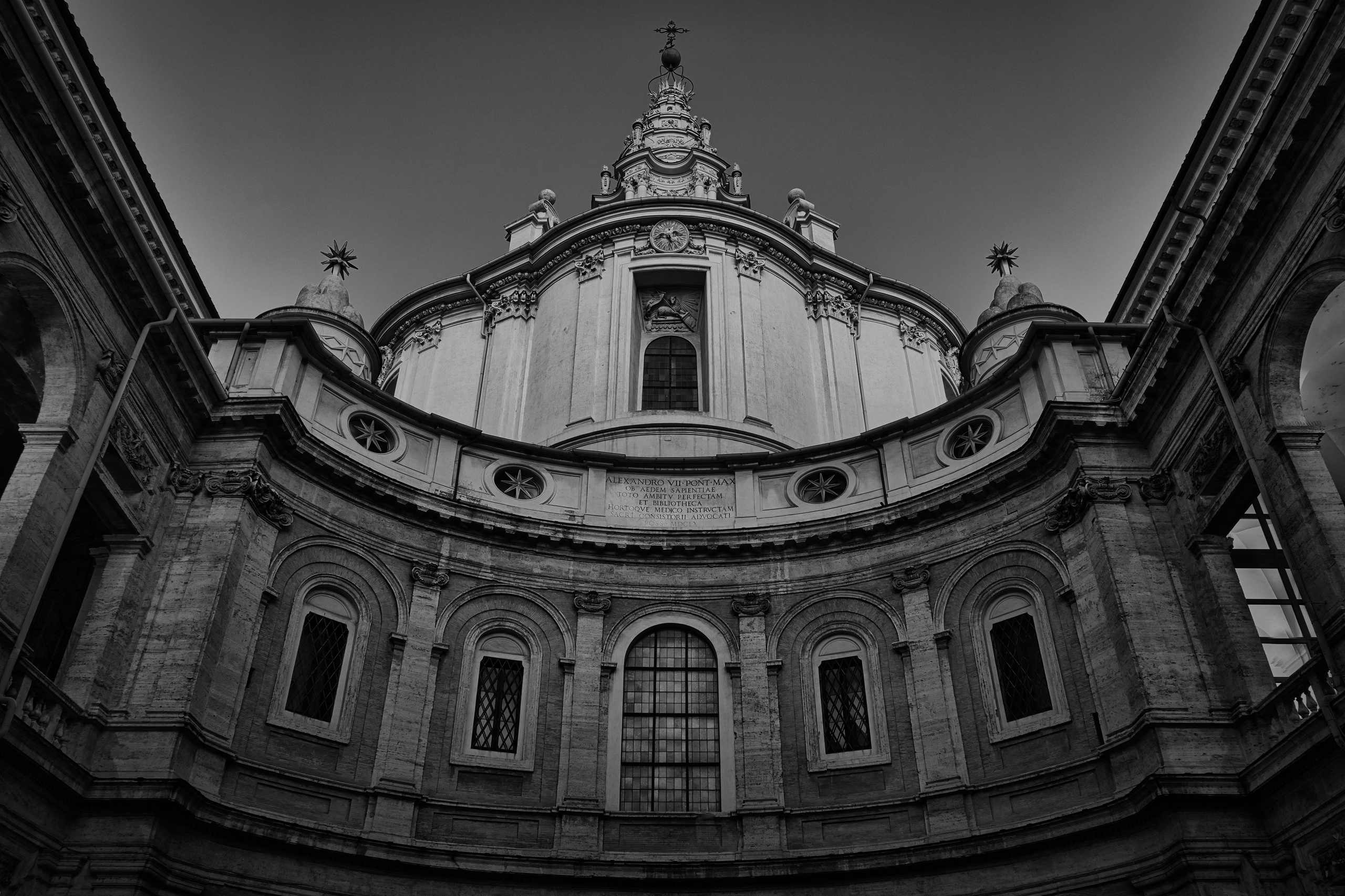 Rome Italy – Chiesa di Sant'Ivo alla Sapienza by Francesco Borromini, Roman Baroque church with distinctive spiral lantern, photographed in black and white fine art photography. Rome, Italy – fine art photography by Eduardo Bartoli.