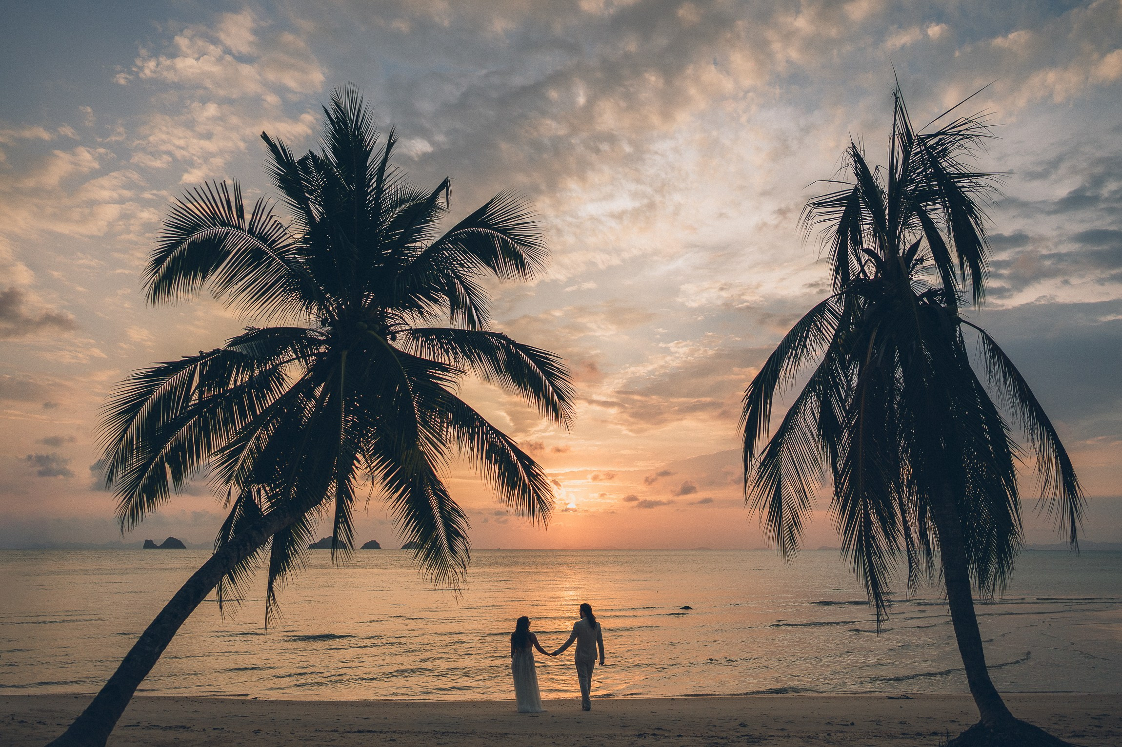 Romantic escape wedding ceremony for two on a secluded beach in Koh Samui, Thailand at sunset