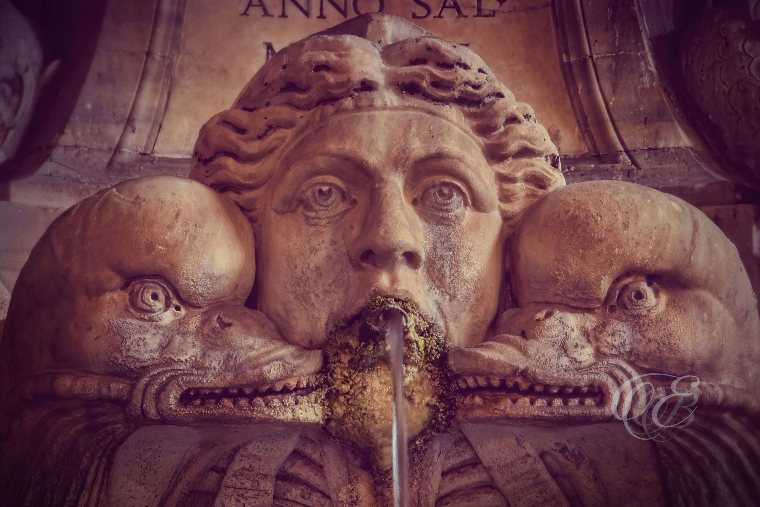 Rome, Italy – Close-up of sculpture detail in Piazza della Rotonda near the Pantheon, showing classical stone carving and architectural surroundings – Eduardo Bartoli Photography.