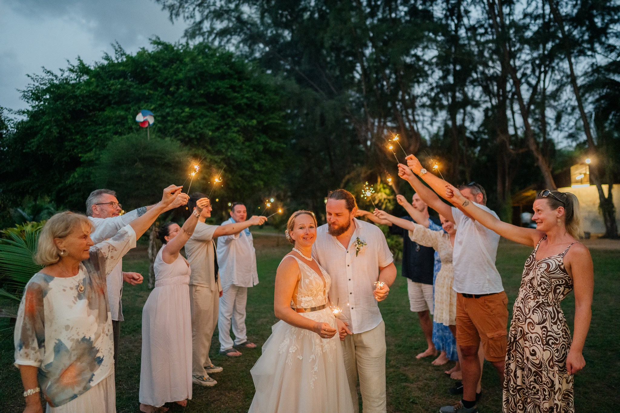 Destination beach wedding in Koh Samui, Thailand with the couple, family members and friends enjoying a tropical wedding ceremony by the sea