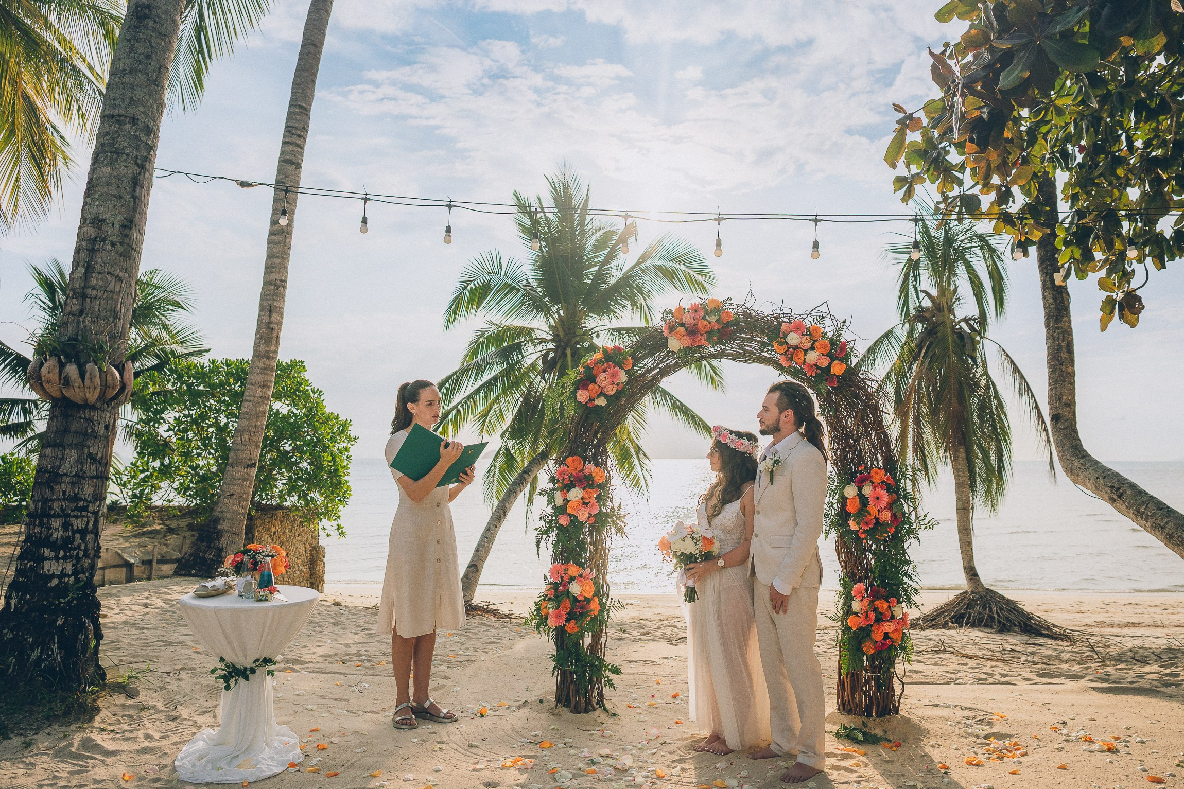 Bride and groom enjoying a just for 2 beach wedding in Koh Samui, Thailand, surrounded by tropical scenery and ocean views